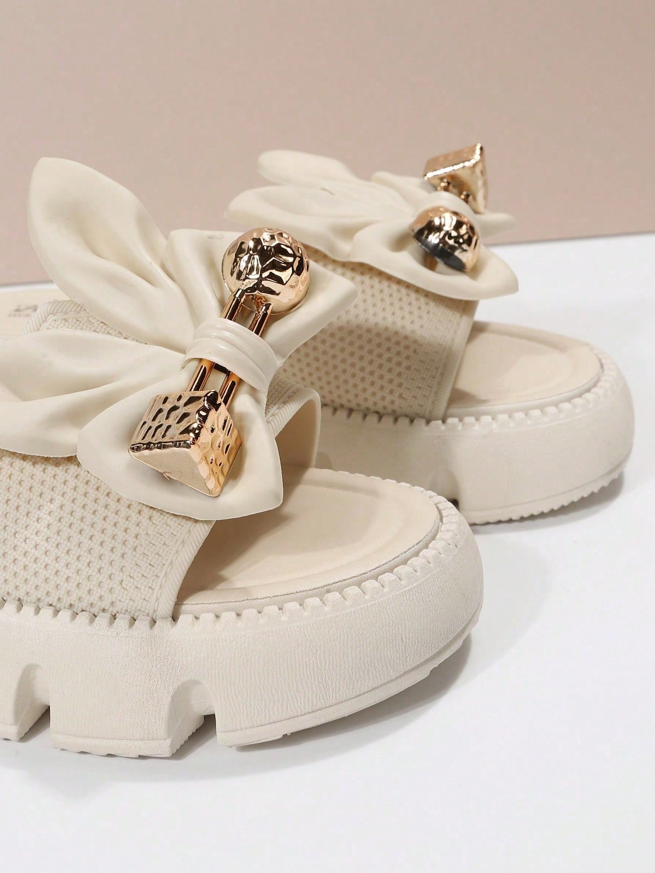 Women's plus size thick sole slip-on sandals with bowknot detail, open toe design, low heel, and PU leather upper.