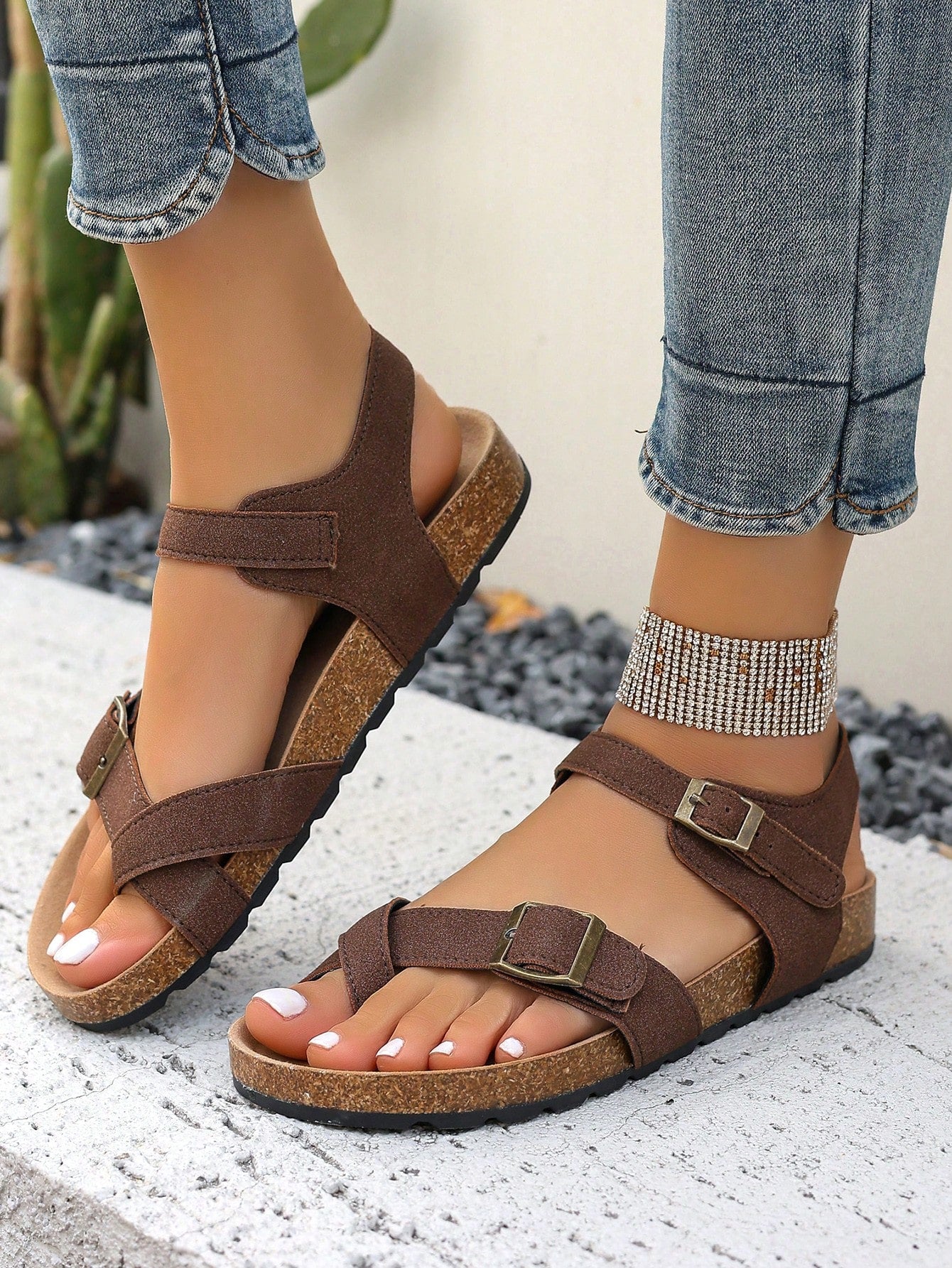 Women's plus size slip-on gladiator flat sandals with open toe and buckle detail, designed for beach and vacation wear.
