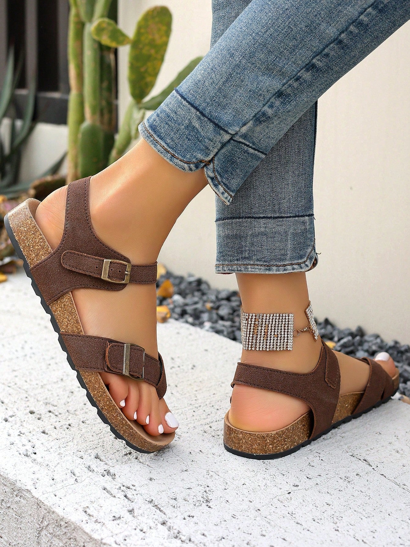 Women's plus size slip-on gladiator flat sandals with open toe and buckle detail, designed for beach and vacation wear.