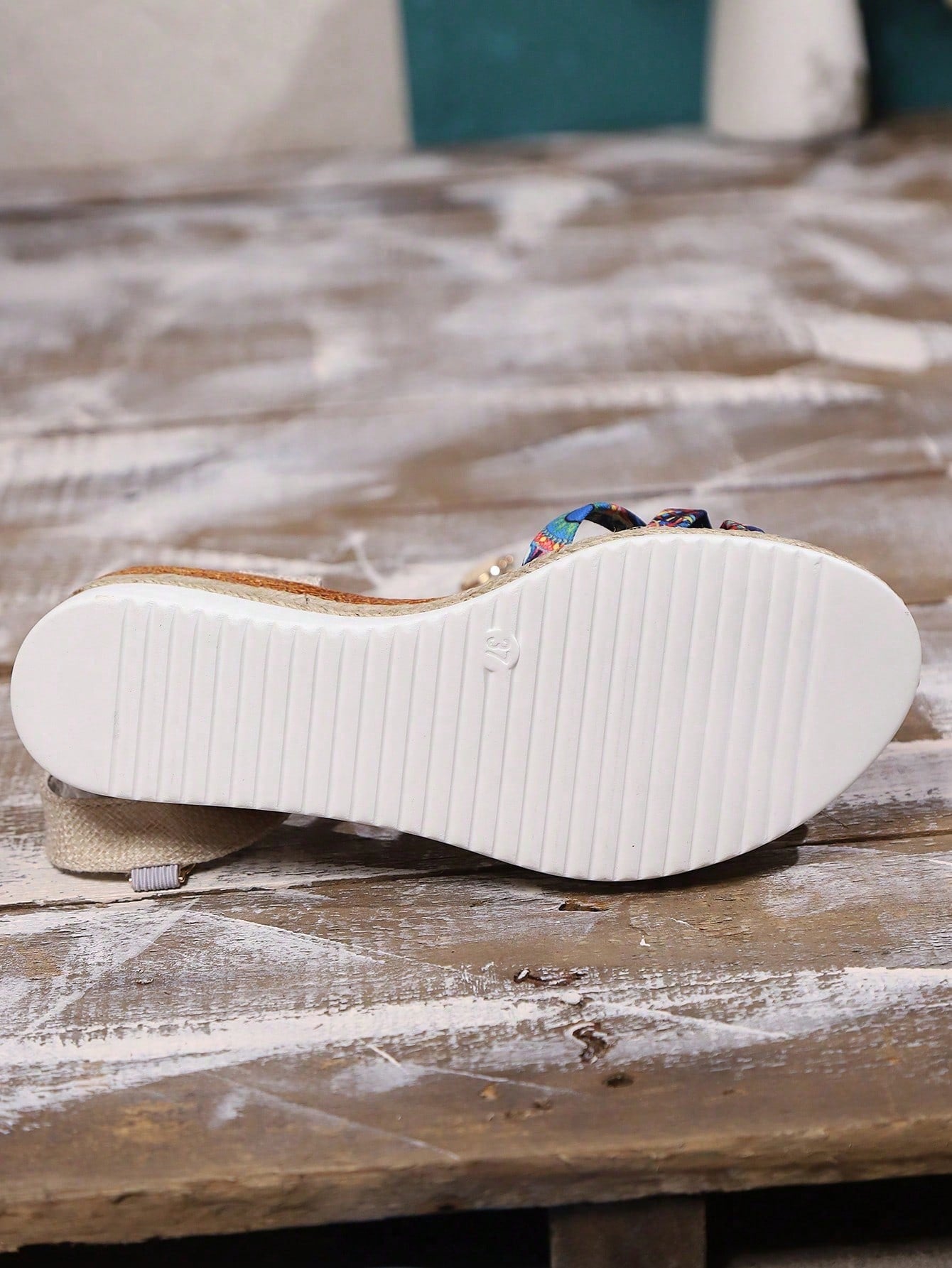 Women’s open-toe wedge sandals with a woven platform-style sole, ankle buckle strap, and mid heel, shown in a casual outdoor style.