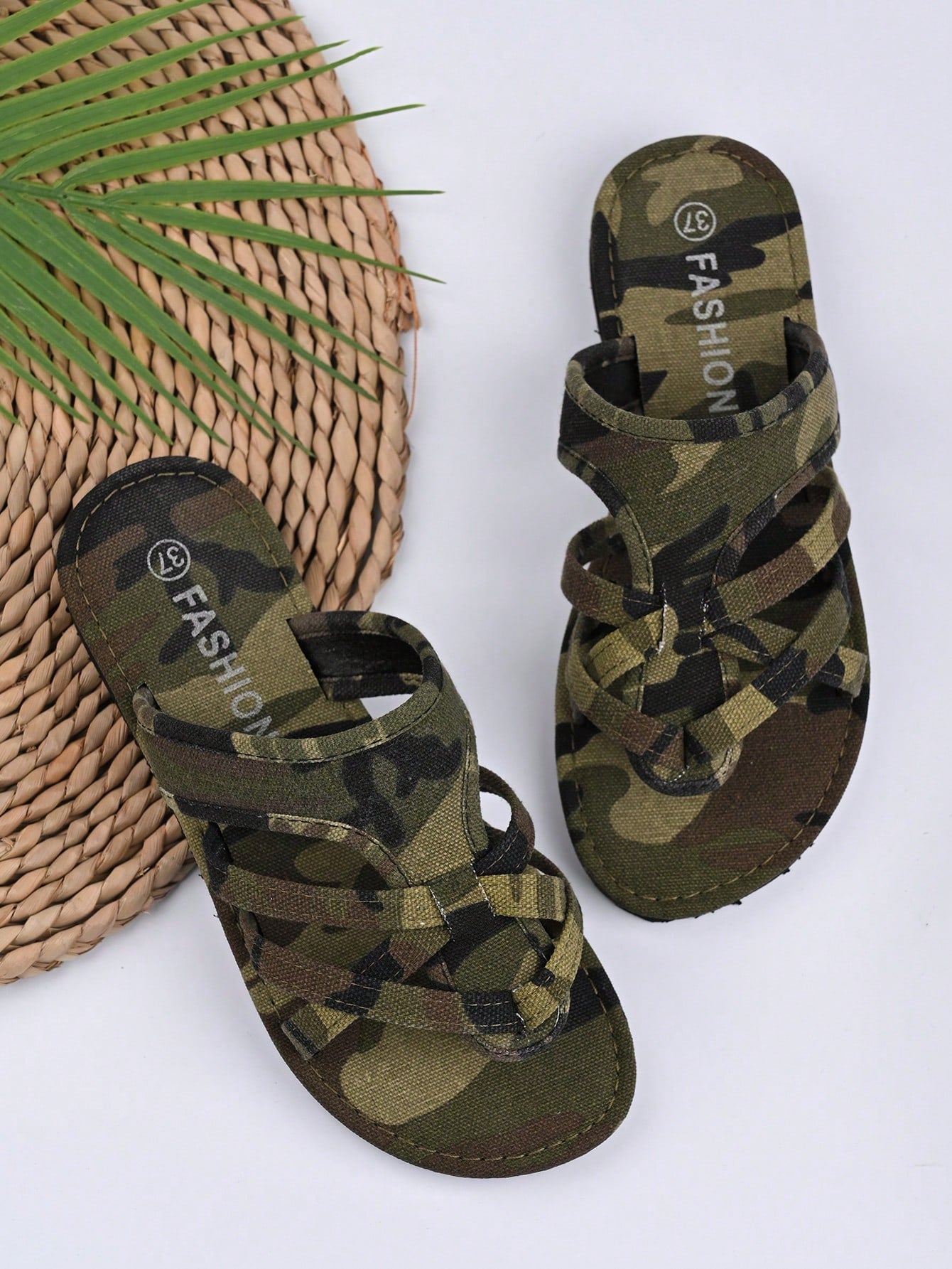 Women’s army green flat slide sandals with criss cross straps and open toe design, casual beach slippers with lightweight look.