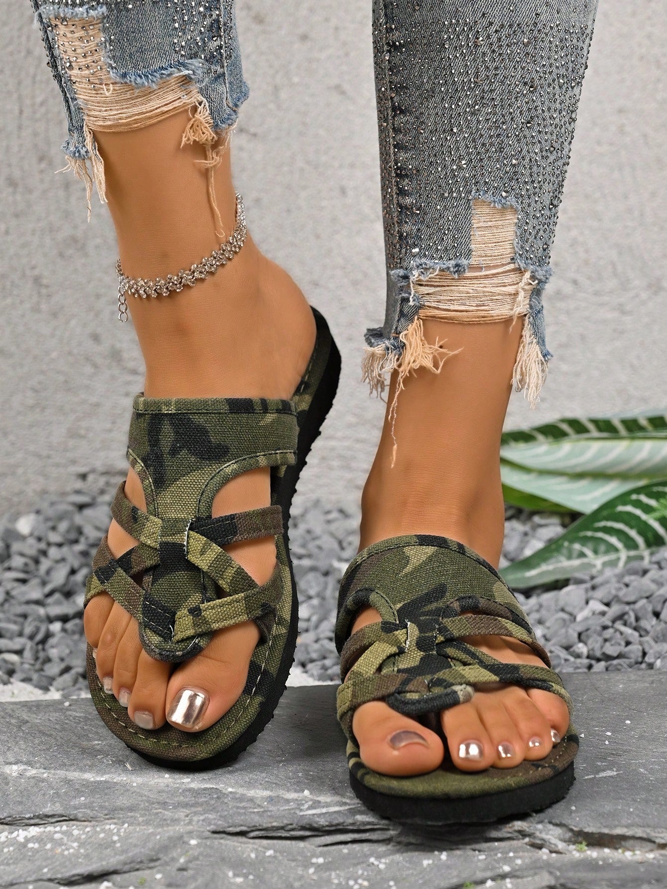 Women’s army green flat slide sandals with criss cross straps and open toe design, casual beach slippers with lightweight look.