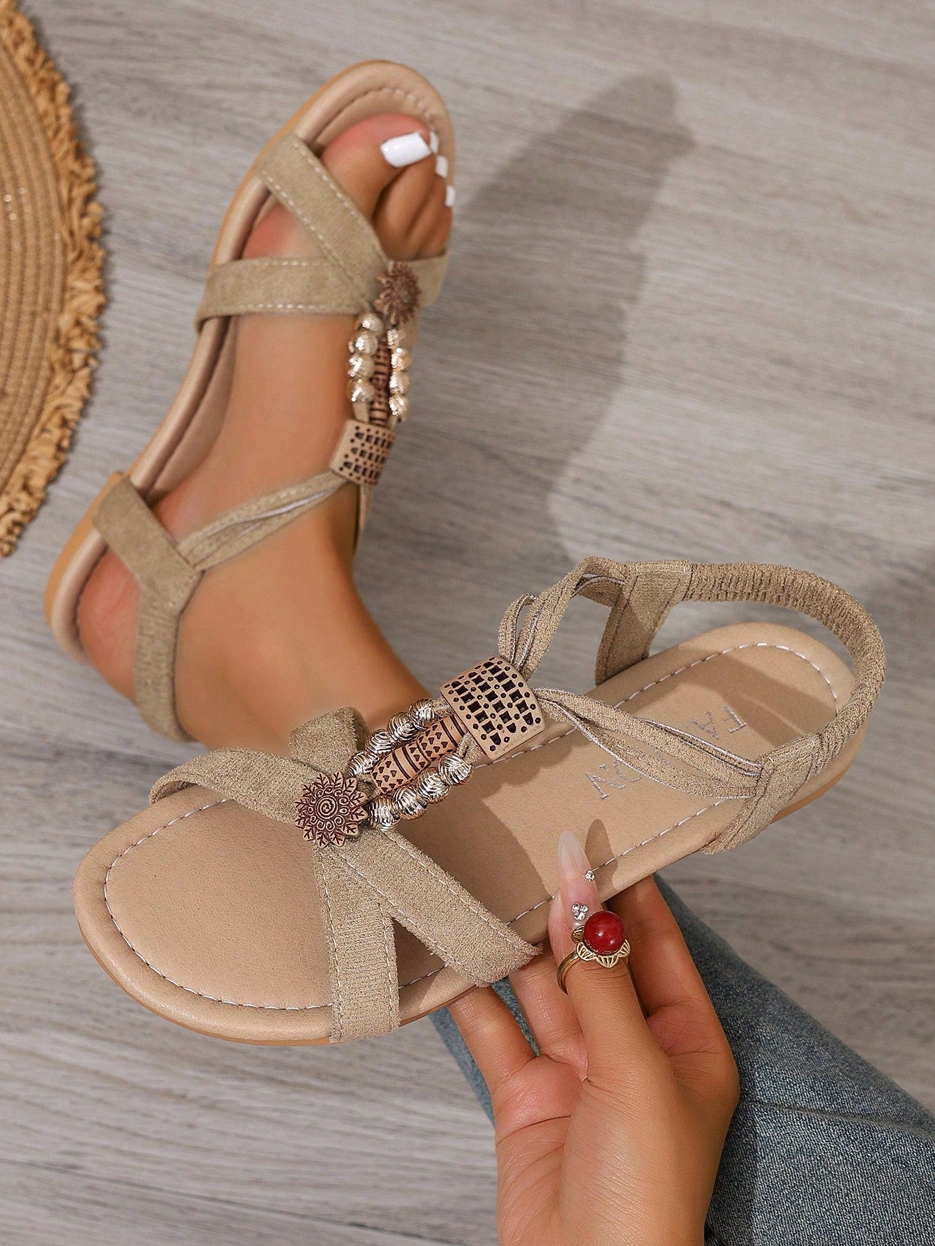 Women's bohemian flat slingback sandals with braided beaded details and open toe, designed for beach and vacation outfits.