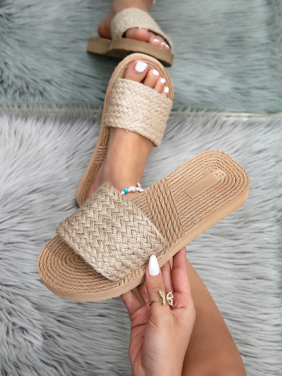 Women's camel wedge slide sandals with open toe, thong slip-on design, and braided woven-style strap details.