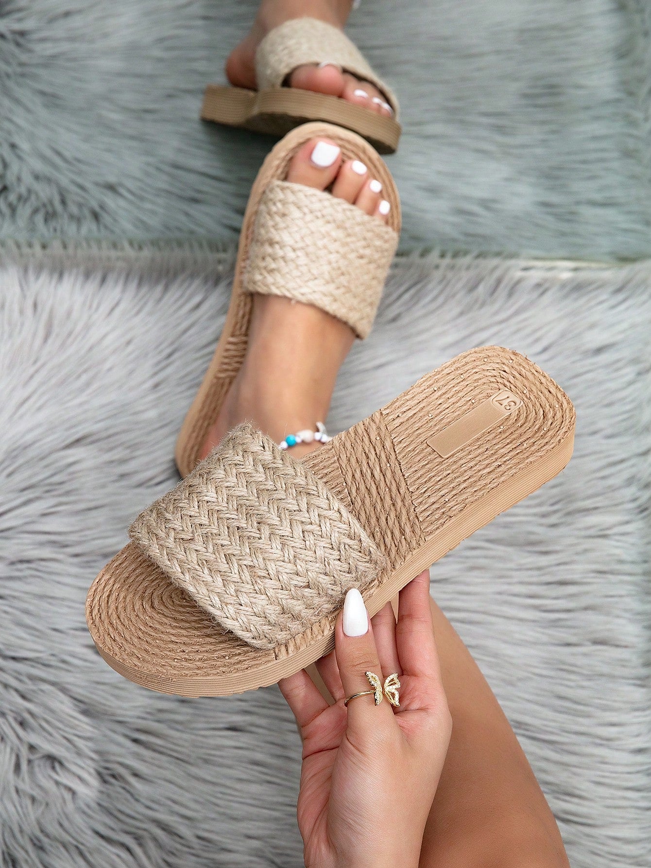 Women's camel wedge slide sandals with open toe, thong slip-on design, and braided woven-style strap details.