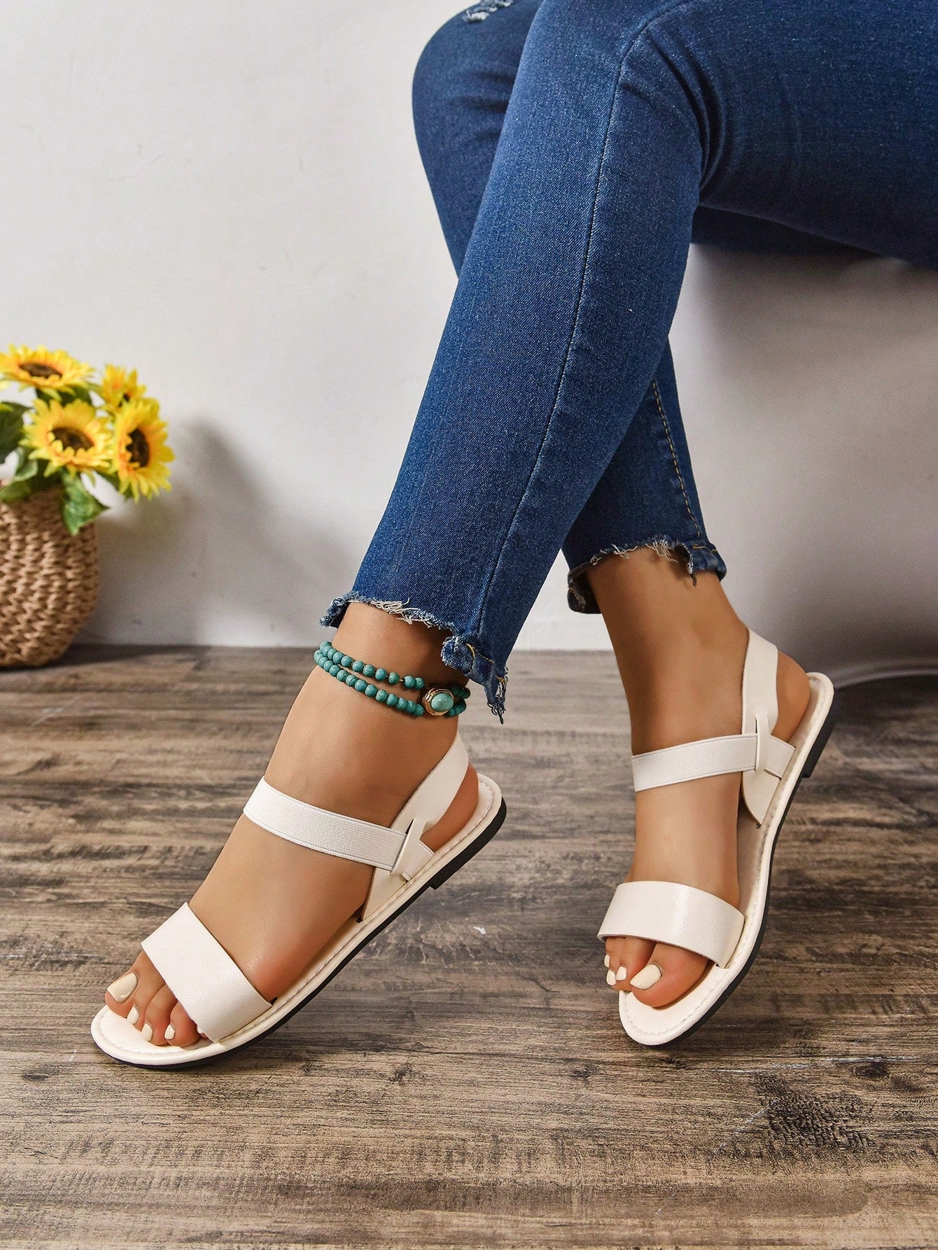 Women's wide fit flat gladiator sandals with woven textured straps, open toe, slip-on design, and lettuce trim detail.