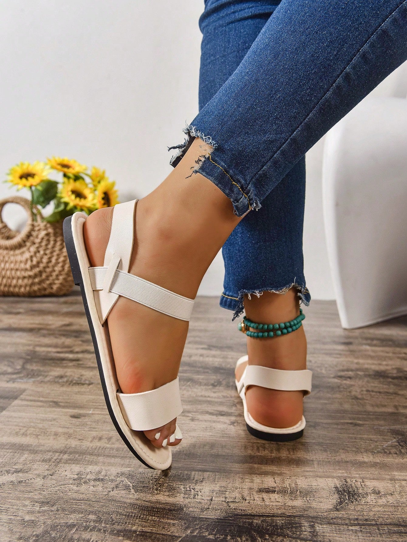 Women's wide fit flat gladiator sandals with woven textured straps, open toe, slip-on design, and lettuce trim detail.