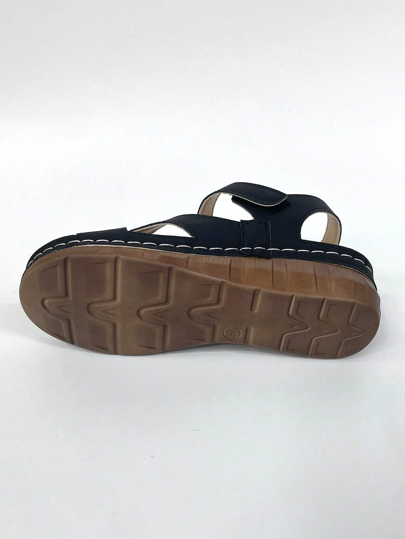 Women's platform sandals with hook-and-loop straps, crisscross upper detail, open toe, and chunky heel.