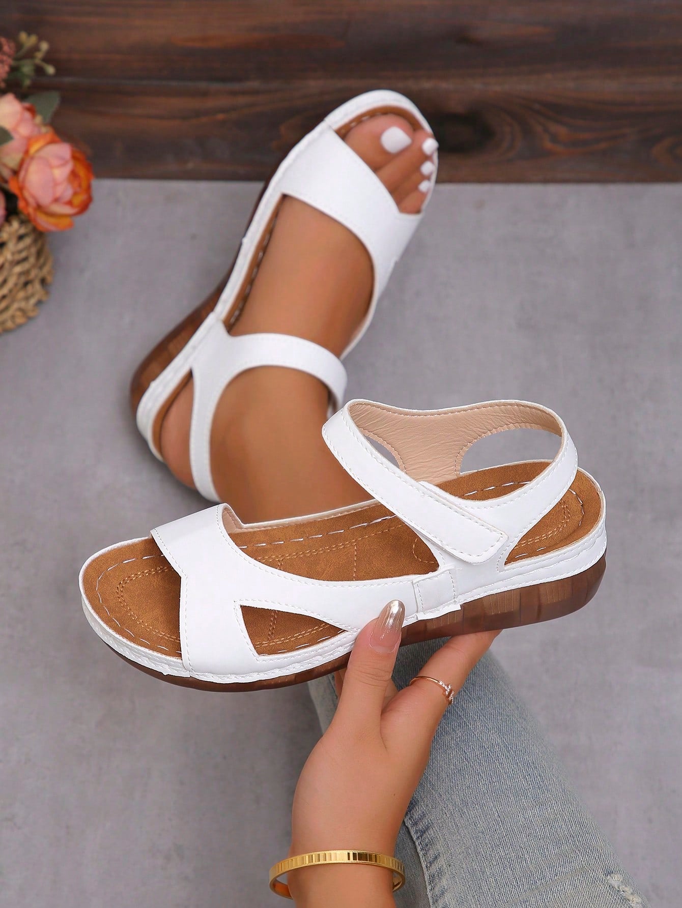 Women's platform sandals with hook-and-loop straps, crisscross upper detail, open toe, and chunky heel.