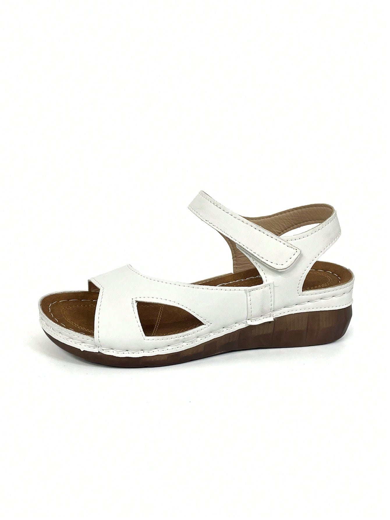 Women's platform sandals with hook-and-loop straps, crisscross upper detail, open toe, and chunky heel.
