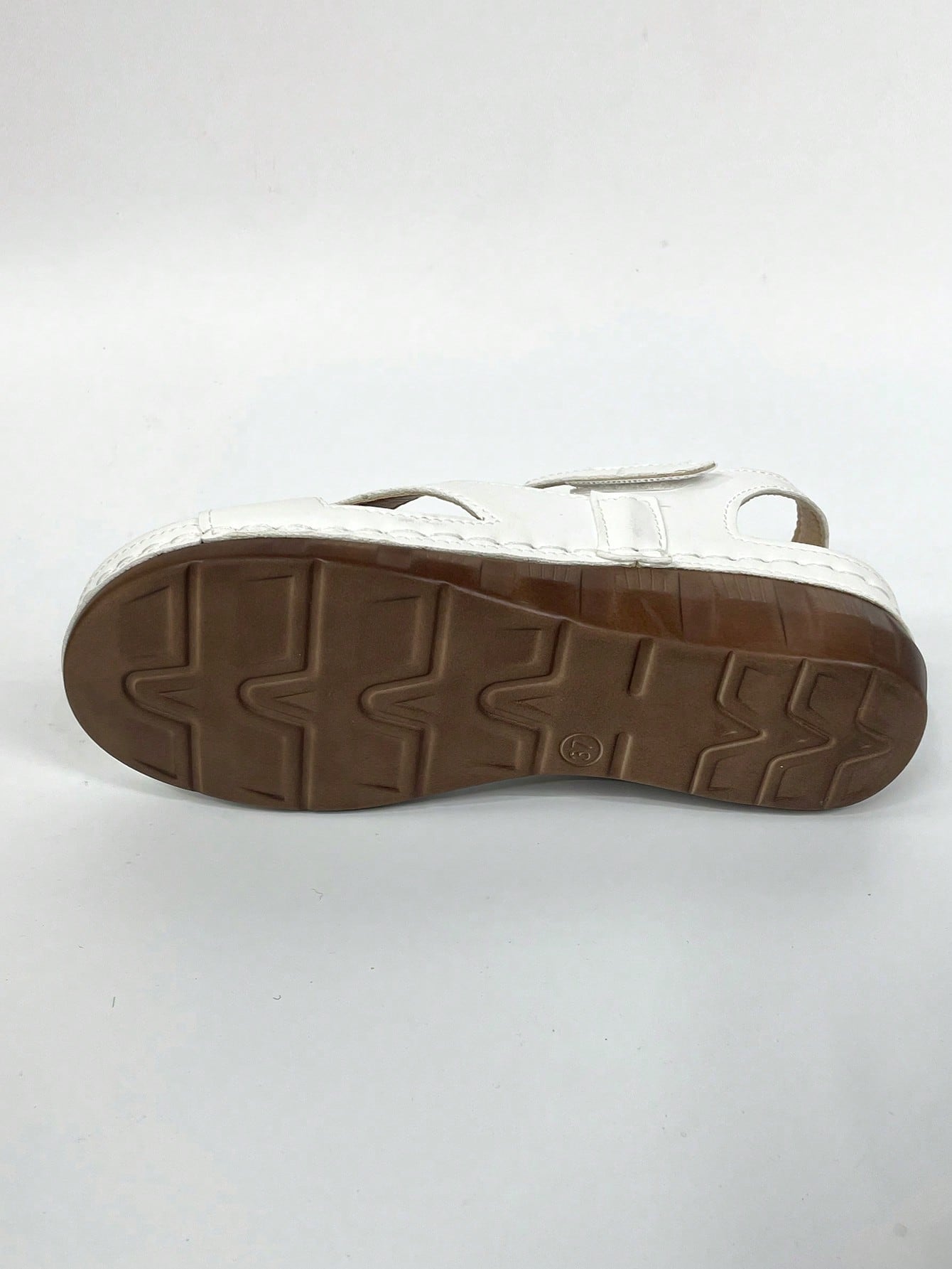 Women's platform sandals with hook-and-loop straps, crisscross upper detail, open toe, and chunky heel.