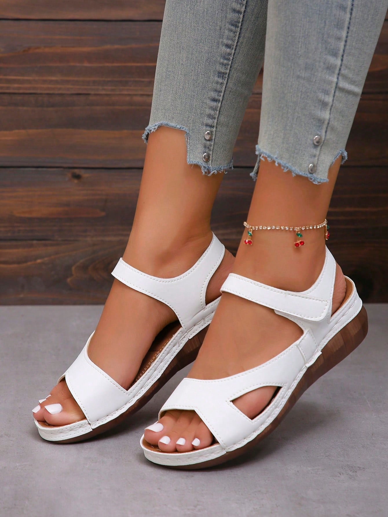 Women's platform sandals with hook-and-loop straps, crisscross upper detail, open toe, and chunky heel.