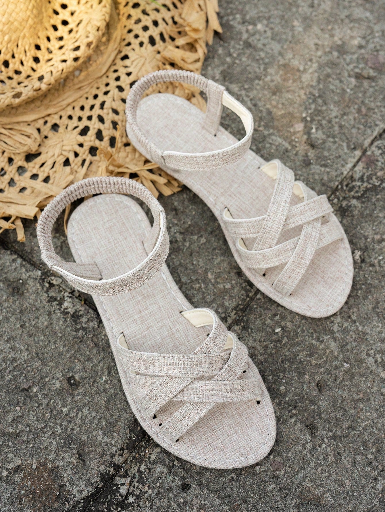 Women's flat thick sole gladiator sandals with cross adjustable straps and open toe, suitable for casual, vacation, and beach wear.