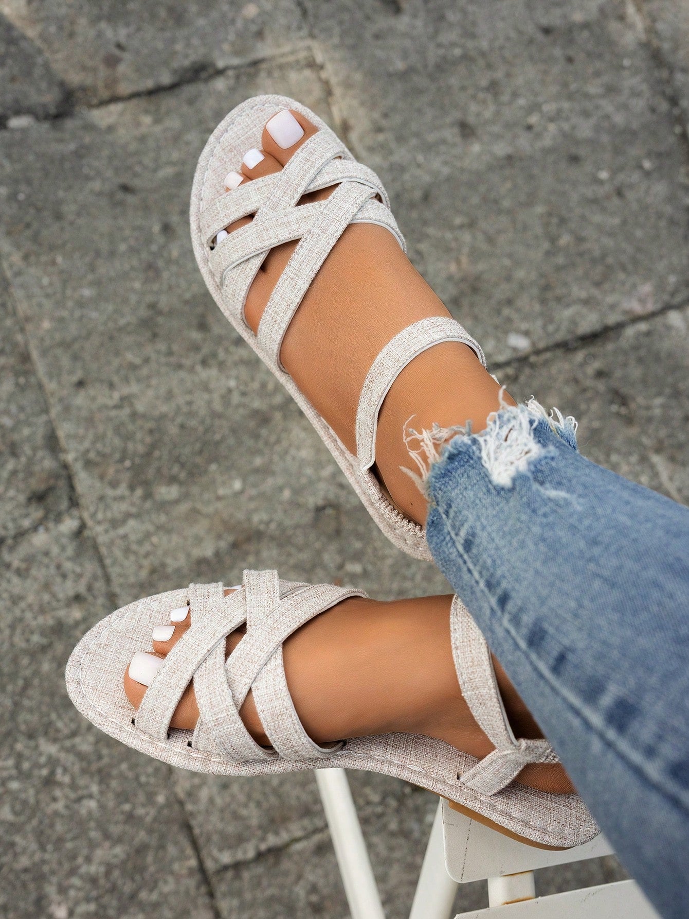 Women's flat thick sole gladiator sandals with cross adjustable straps and open toe, suitable for casual, vacation, and beach wear.