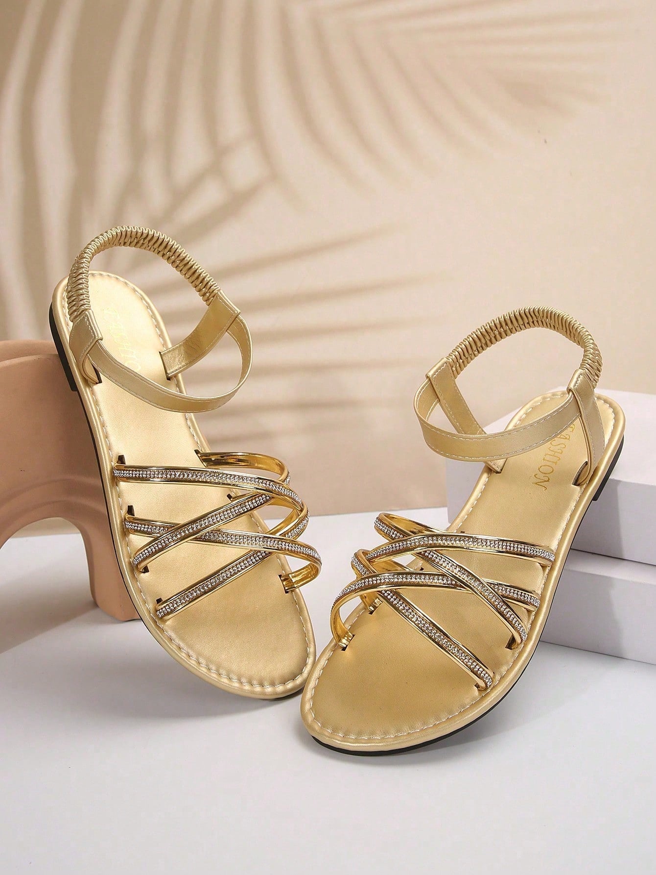 Plus size women's flat slide sandals with criss-cross straps, open toe, elastic band, and rhinestone detail, suitable for casual beach, vacation, and summer outdoor wear.