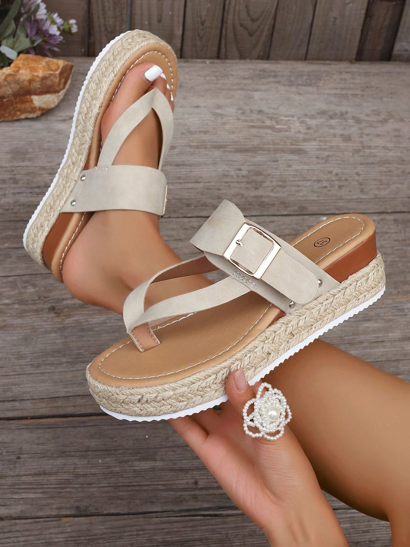 Women's thick sole flip flop sandals with adjustable buckle strap, toe post design, and flatform mid heel in a casual vacation style.
