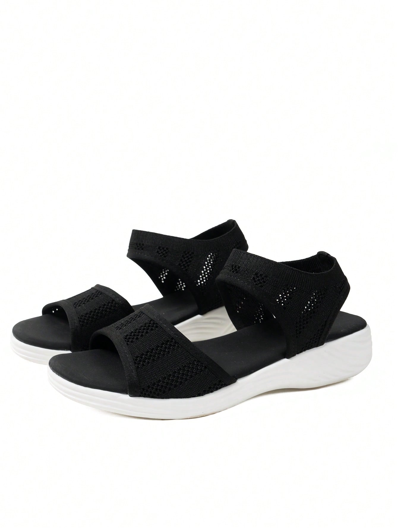 Women's slip-on Roman style platform sandals with breathable cut-out upper, open toe, and flat outdoor-ready sole.