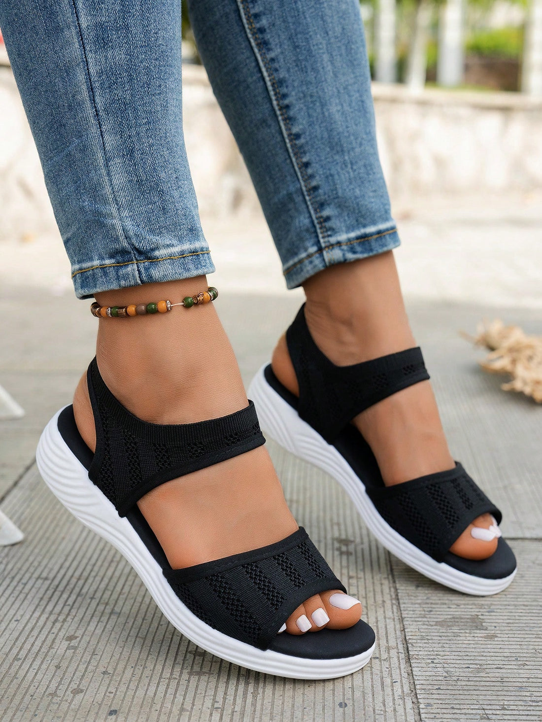 Women's slip-on Roman style platform sandals with breathable cut-out upper, open toe, and flat outdoor-ready sole.