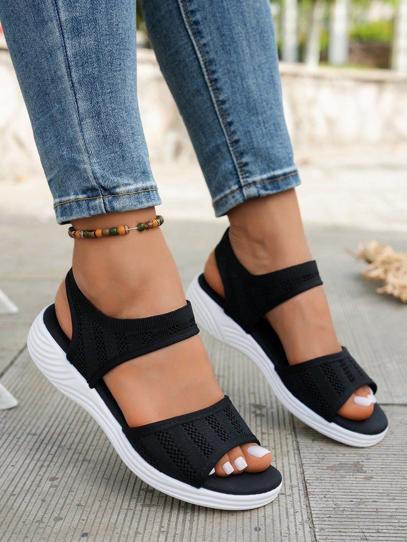 Women's slip-on Roman style platform sandals with breathable cut-out upper, open toe, and flat outdoor-ready sole.