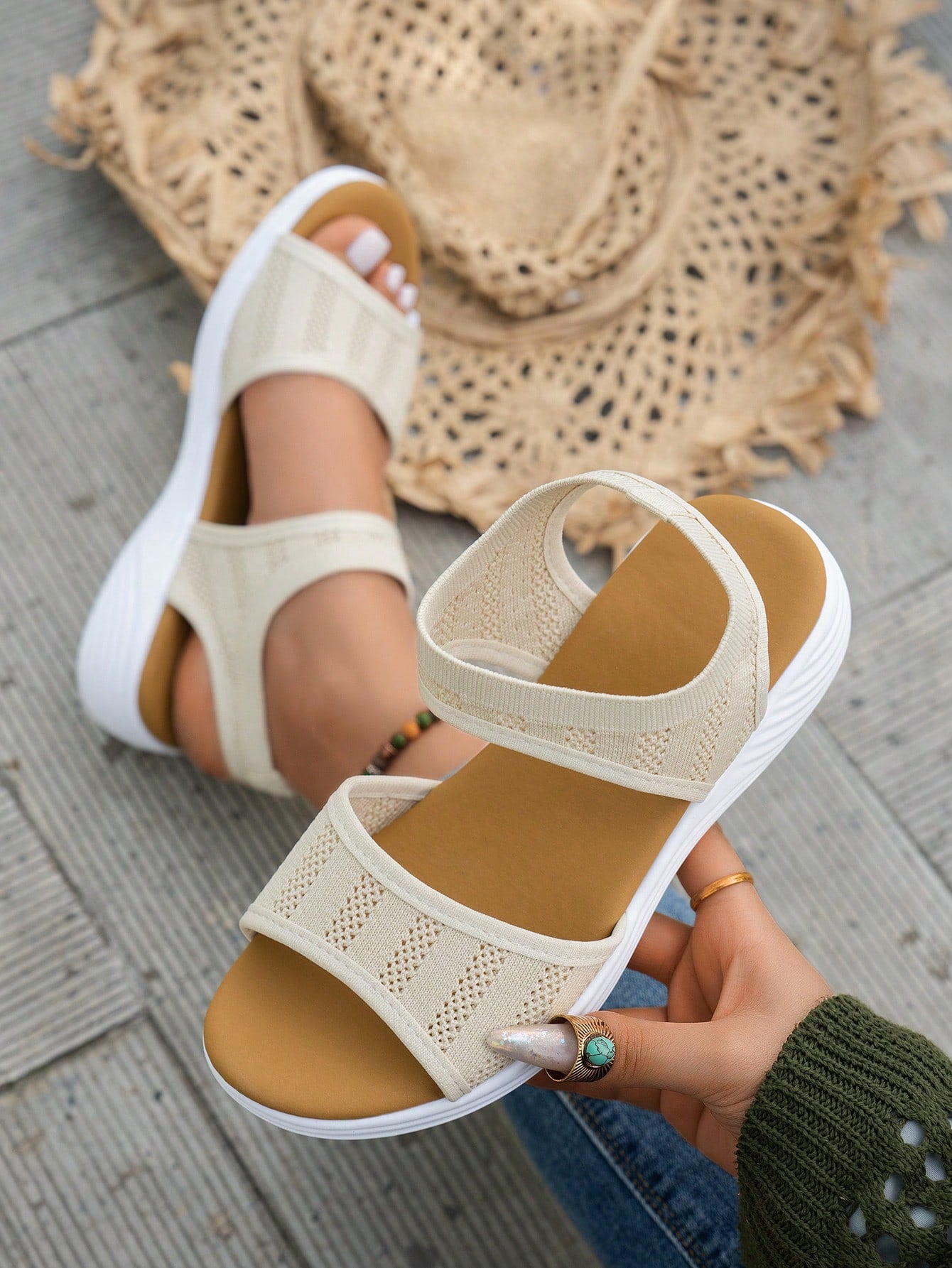 Women's slip-on Roman style platform sandals with breathable cut-out upper, open toe, and flat outdoor-ready sole.