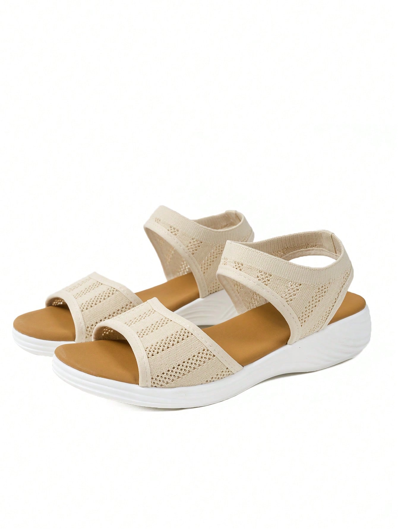 Women's slip-on Roman style platform sandals with breathable cut-out upper, open toe, and flat outdoor-ready sole.