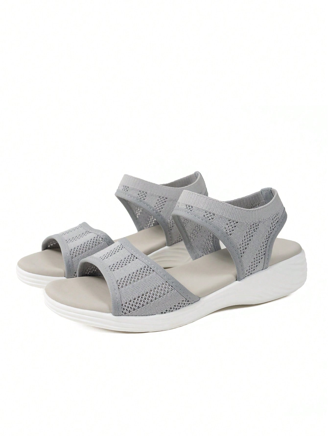 Women's slip-on Roman style platform sandals with breathable cut-out upper, open toe, and flat outdoor-ready sole.