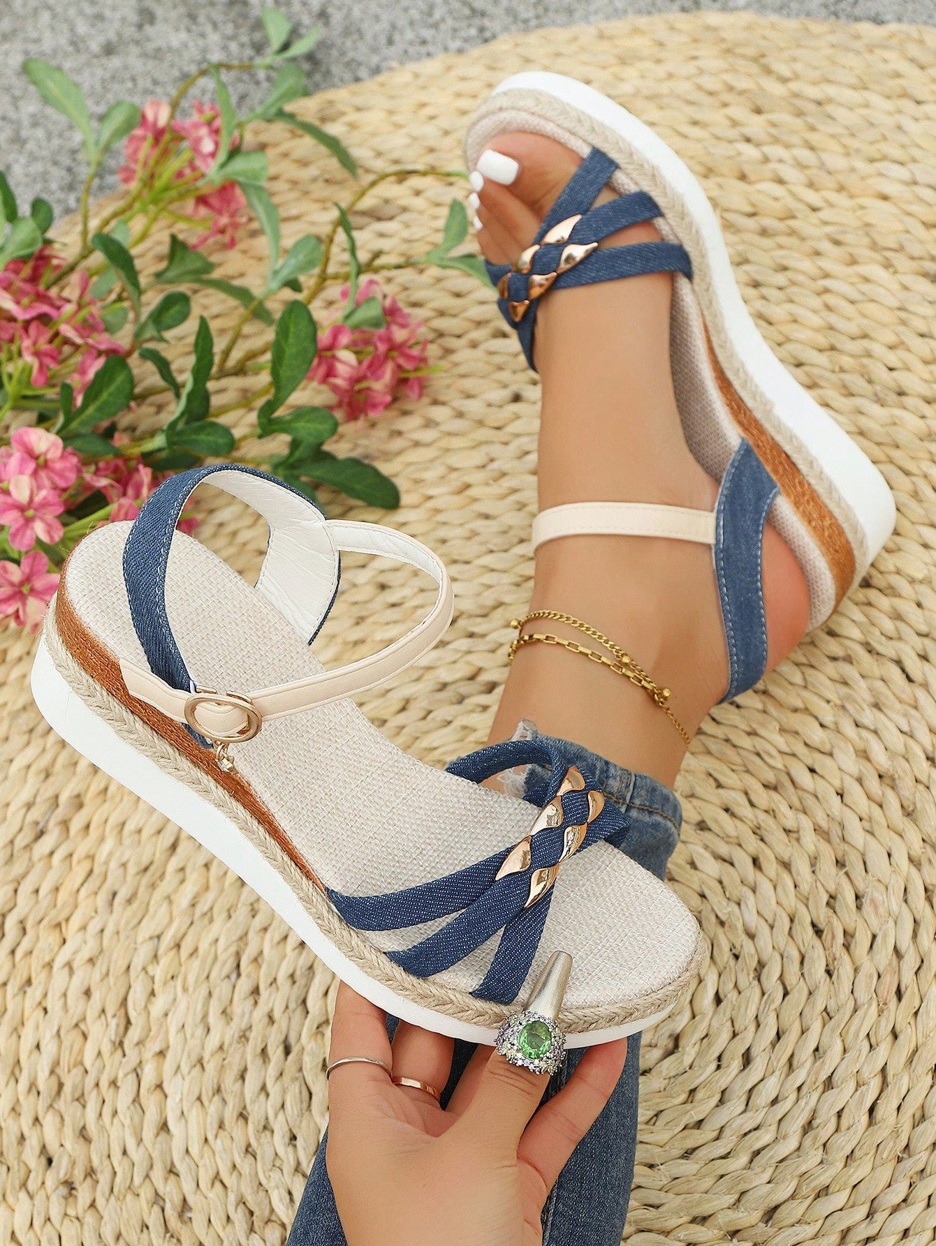 Women’s open-toe wedge sandals with a woven platform-style sole, ankle buckle strap, and mid heel, shown in a casual outdoor style.