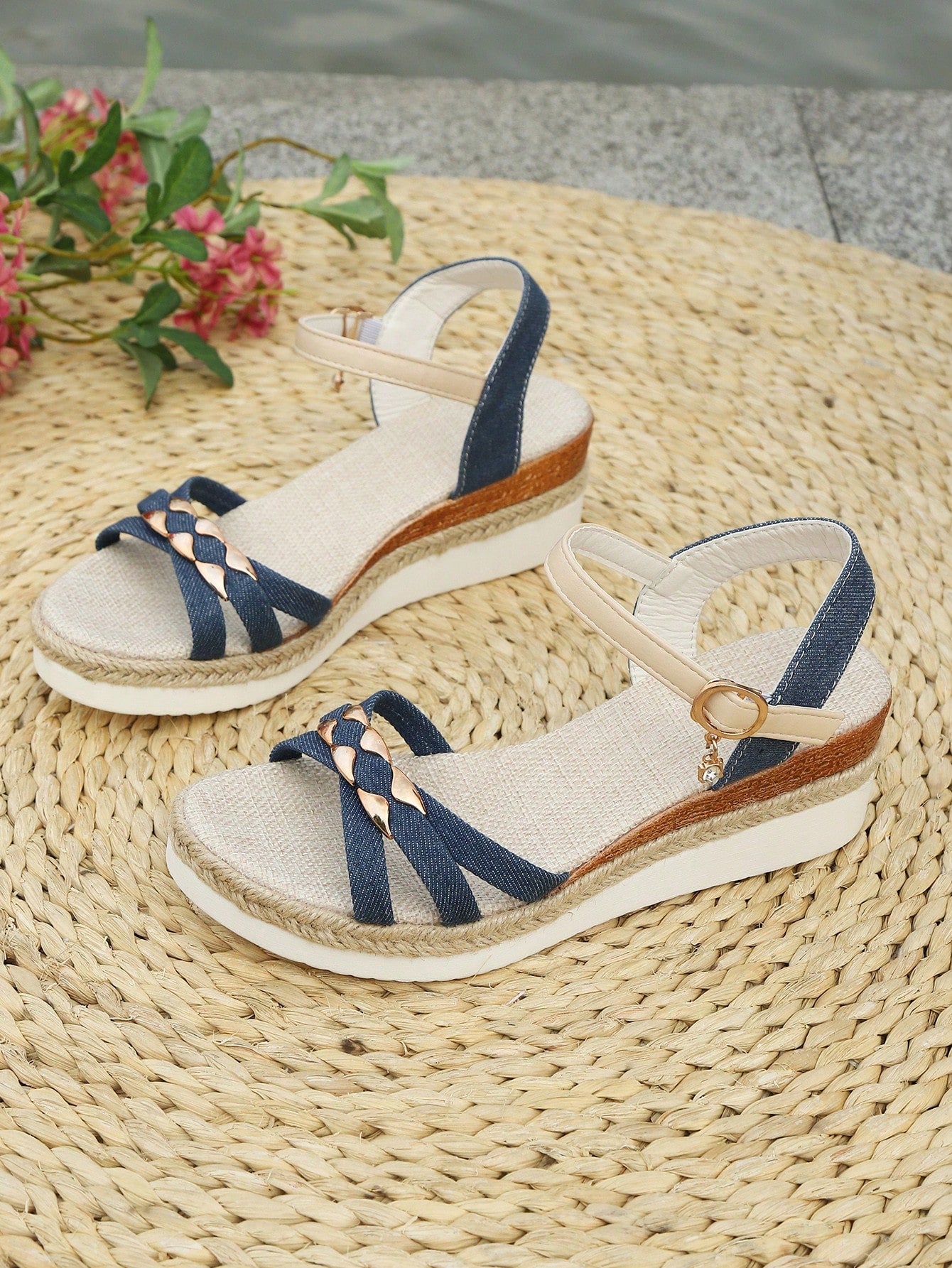 Women’s open-toe wedge sandals with a woven platform-style sole, ankle buckle strap, and mid heel, shown in a casual outdoor style.