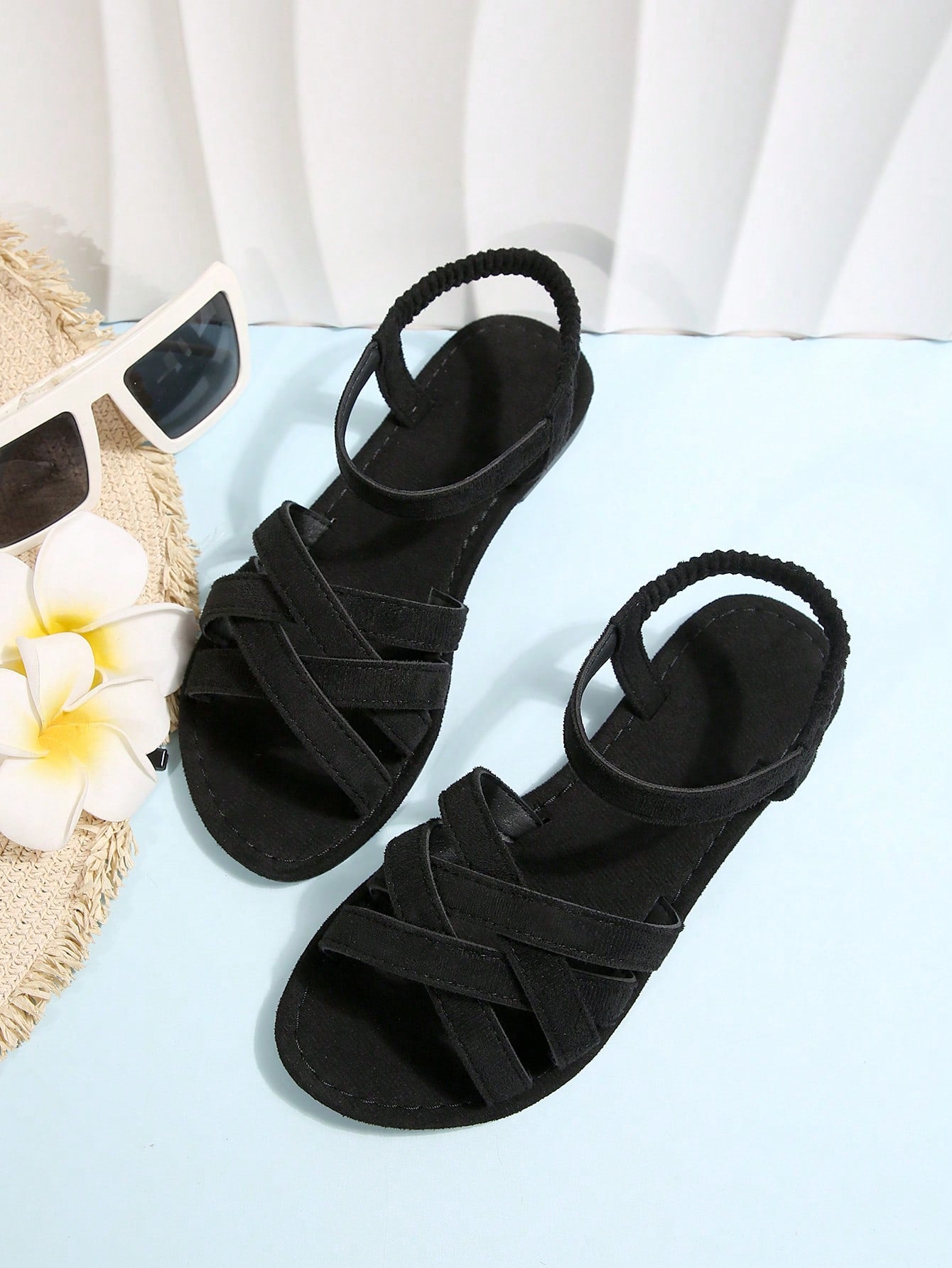 Women's flat thick sole gladiator sandals with cross adjustable straps and open toe, suitable for casual, vacation, and beach wear.