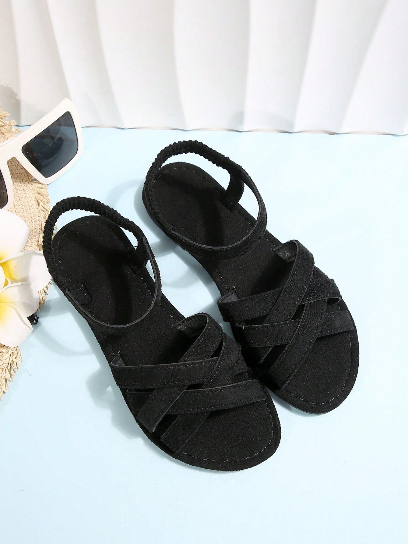 Women's flat thick sole gladiator sandals with cross adjustable straps and open toe, suitable for casual, vacation, and beach wear.