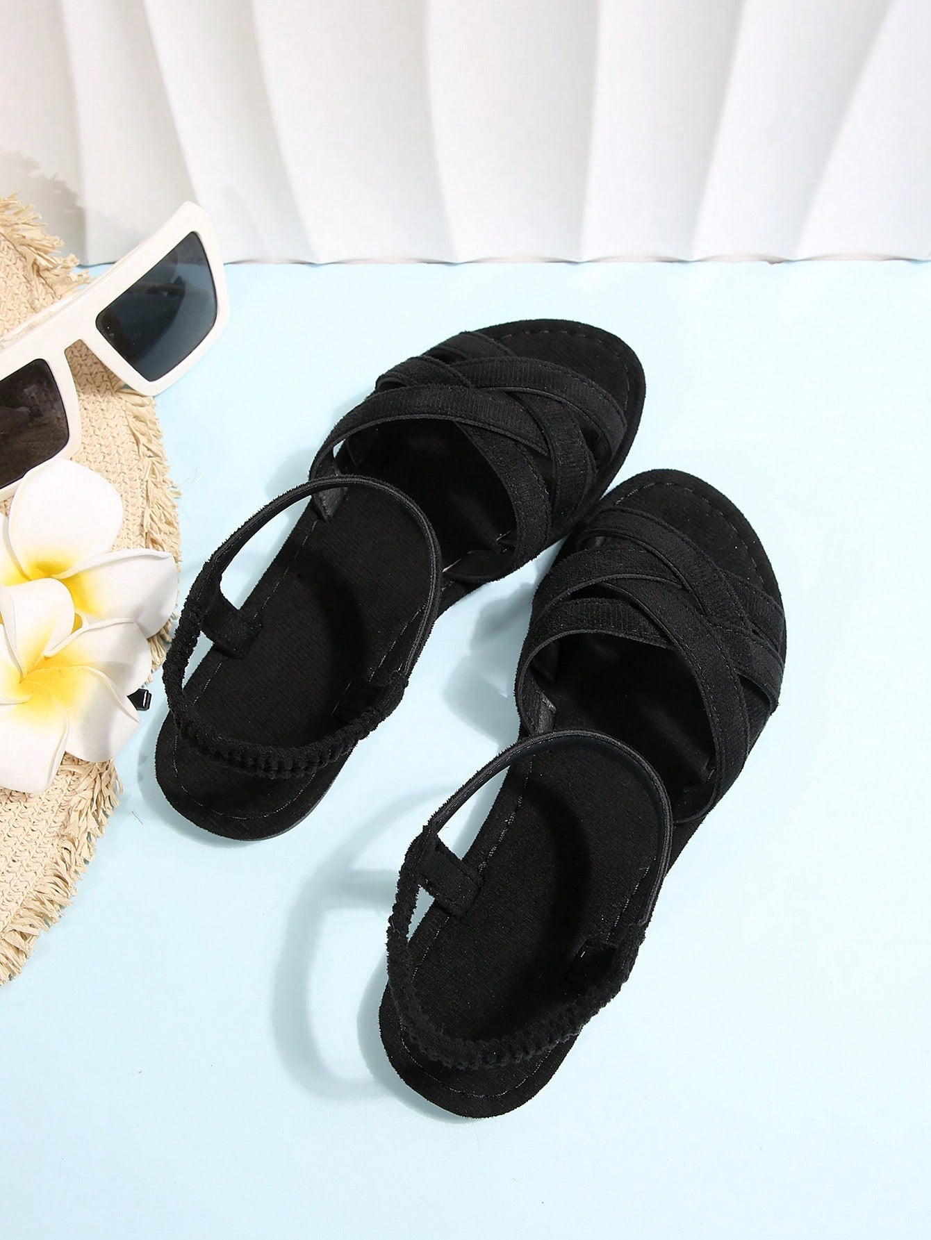 Women's flat thick sole gladiator sandals with cross adjustable straps and open toe, suitable for casual, vacation, and beach wear.