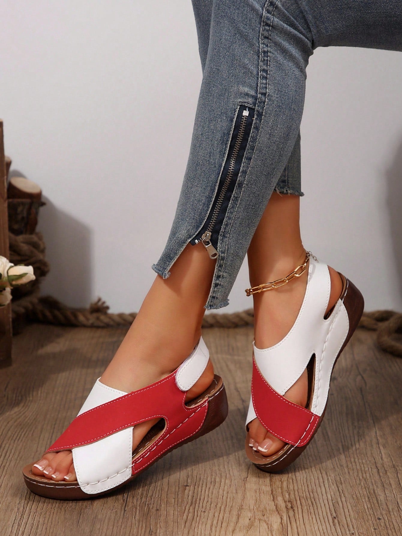 Women's color block platform flat sandals with open toe, criss-cross straps, and hook-loop closure, featuring a low heel thick sole design for casual vacation wear.