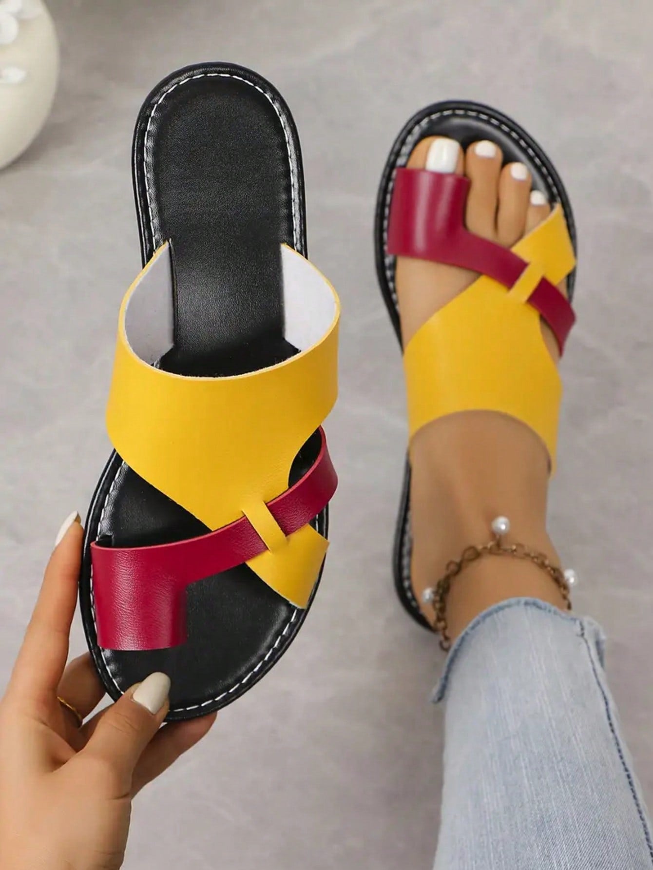 Women’s plus size flat slide sandals with toe-post front and cross-over patchwork upper, designed for casual outdoor and vacation wear.