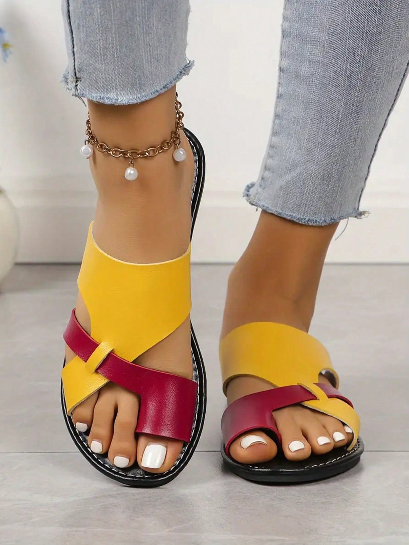 Women’s plus size flat slide sandals with toe-post front and cross-over patchwork upper, designed for casual outdoor and vacation wear.