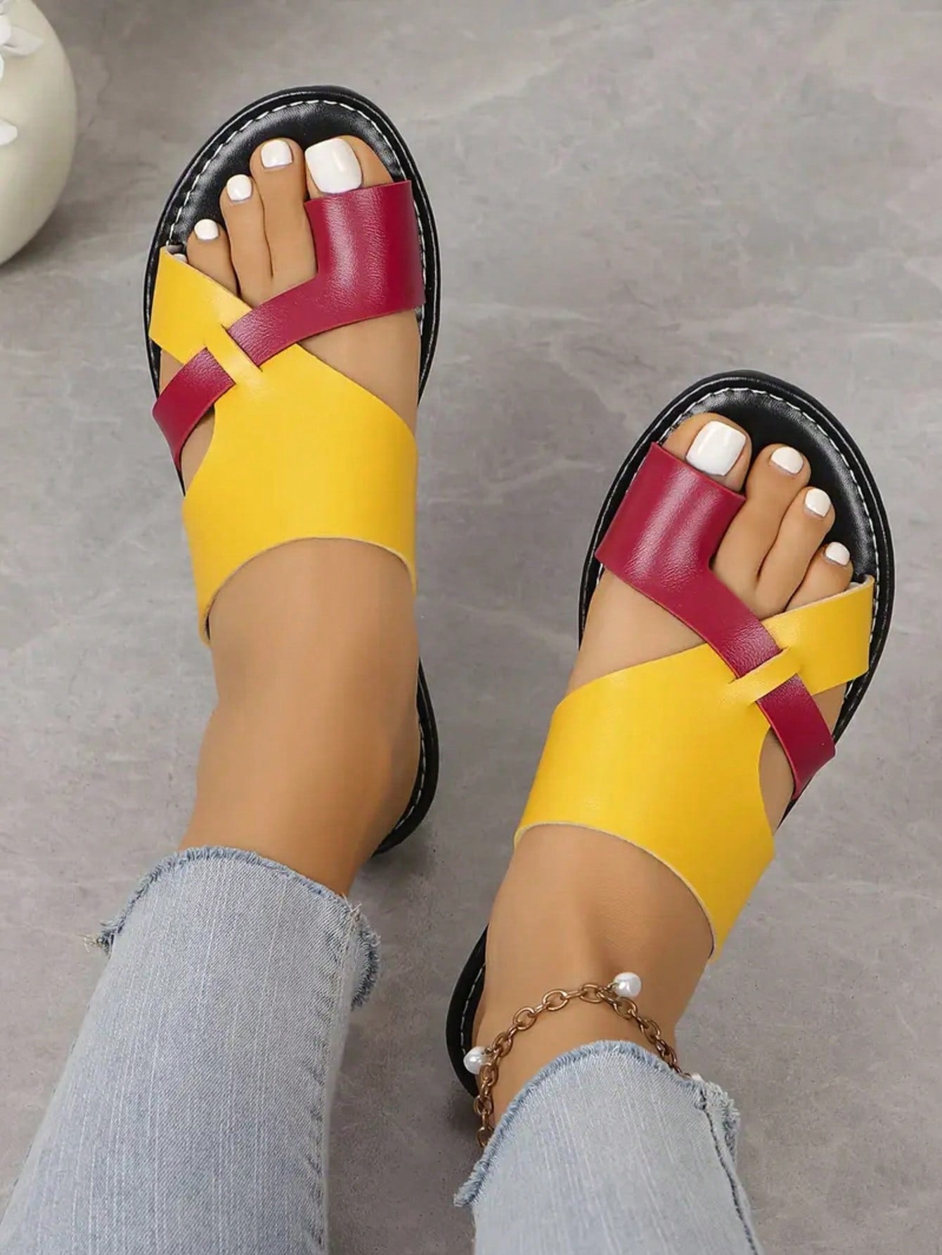 Women’s plus size flat slide sandals with toe-post front and cross-over patchwork upper, designed for casual outdoor and vacation wear.
