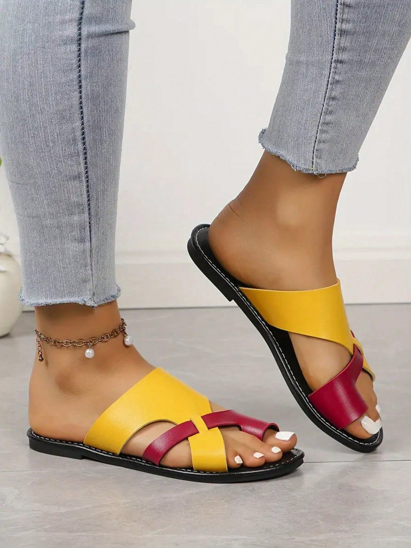 Women’s plus size flat slide sandals with toe-post front and cross-over patchwork upper, designed for casual outdoor and vacation wear.