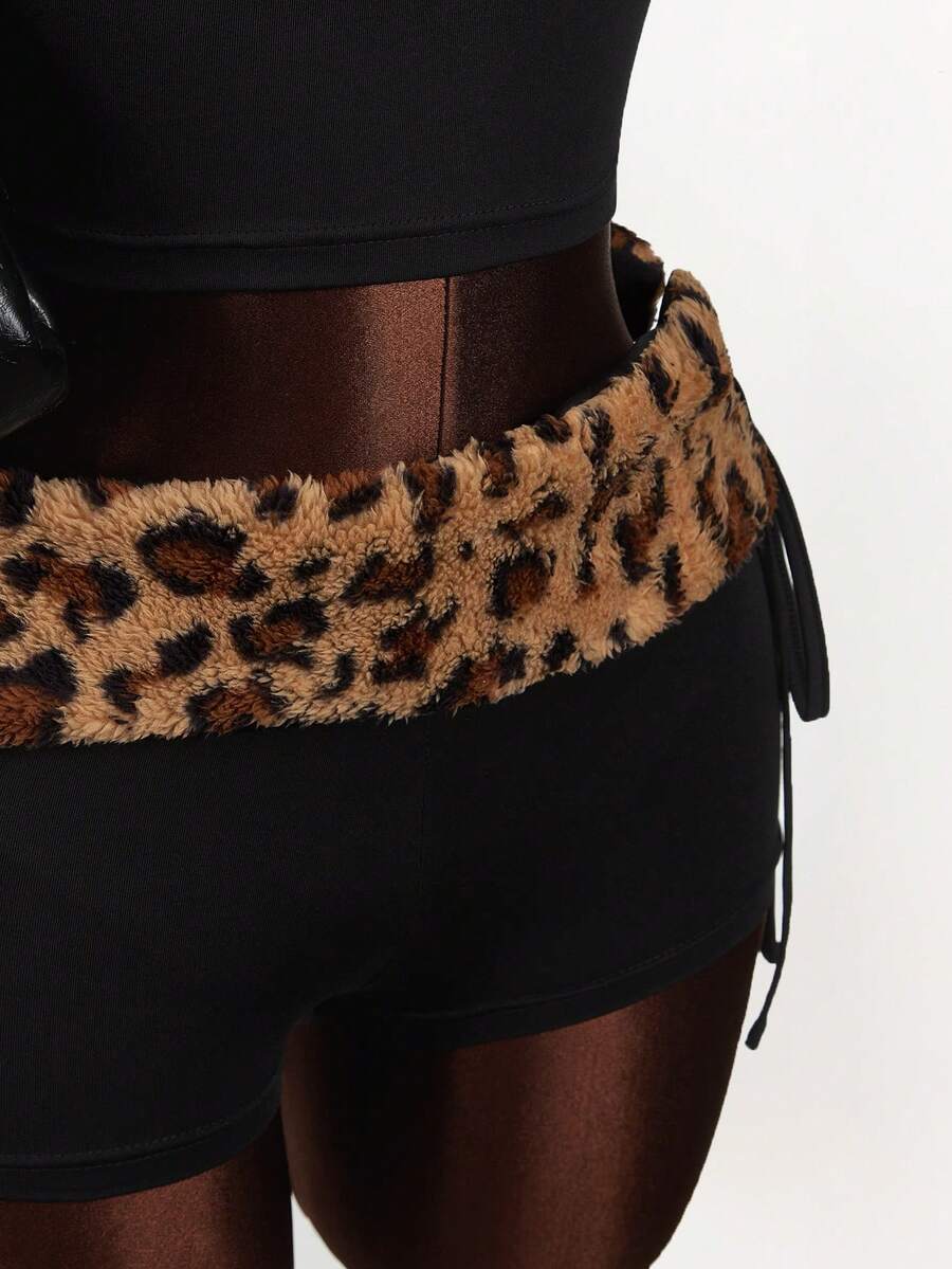 Women's black leopard print two-piece set with strapless bandeau crop top, knot and lace-up details, and matching mini shorts.