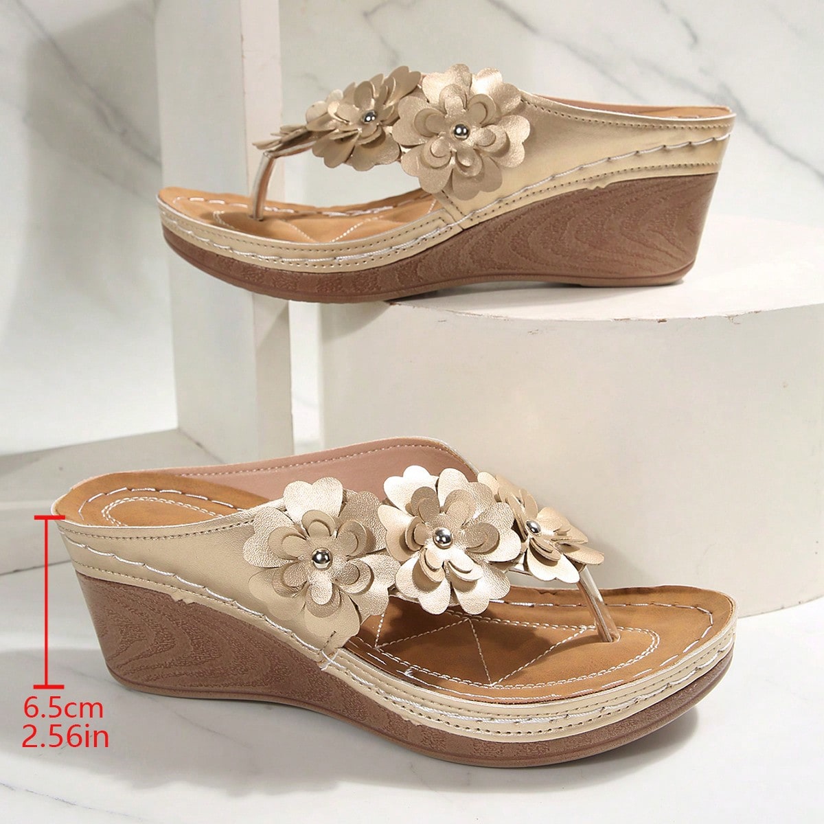 Women's gold platform flip flop wedge sandals with toe post and textured flower detail, slip-on vacation slide style with mid heel.
