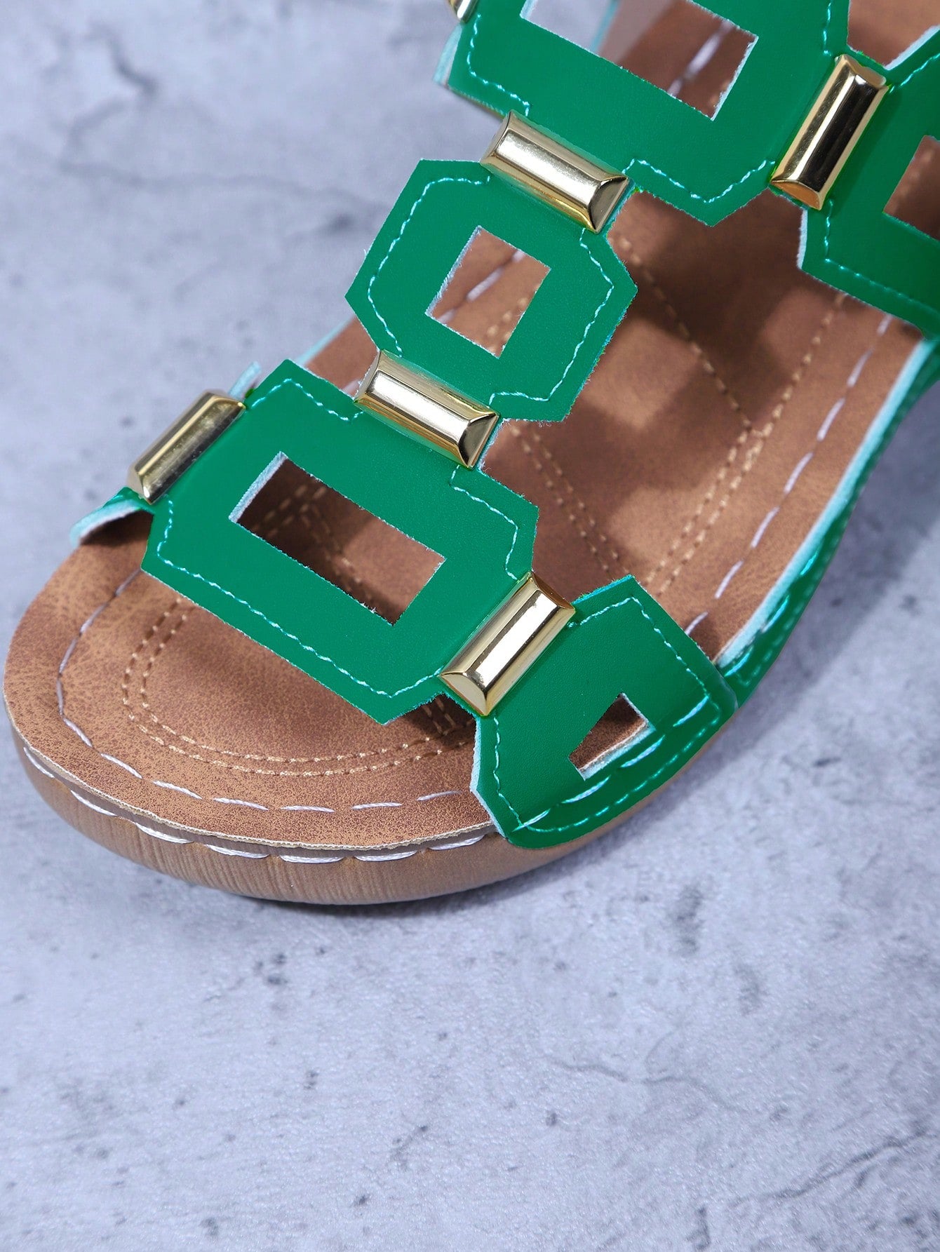 Women's open-toe wedge slide sandals with studded hollow-out upper, cross-over straps, buckle closure, and thick soft sole