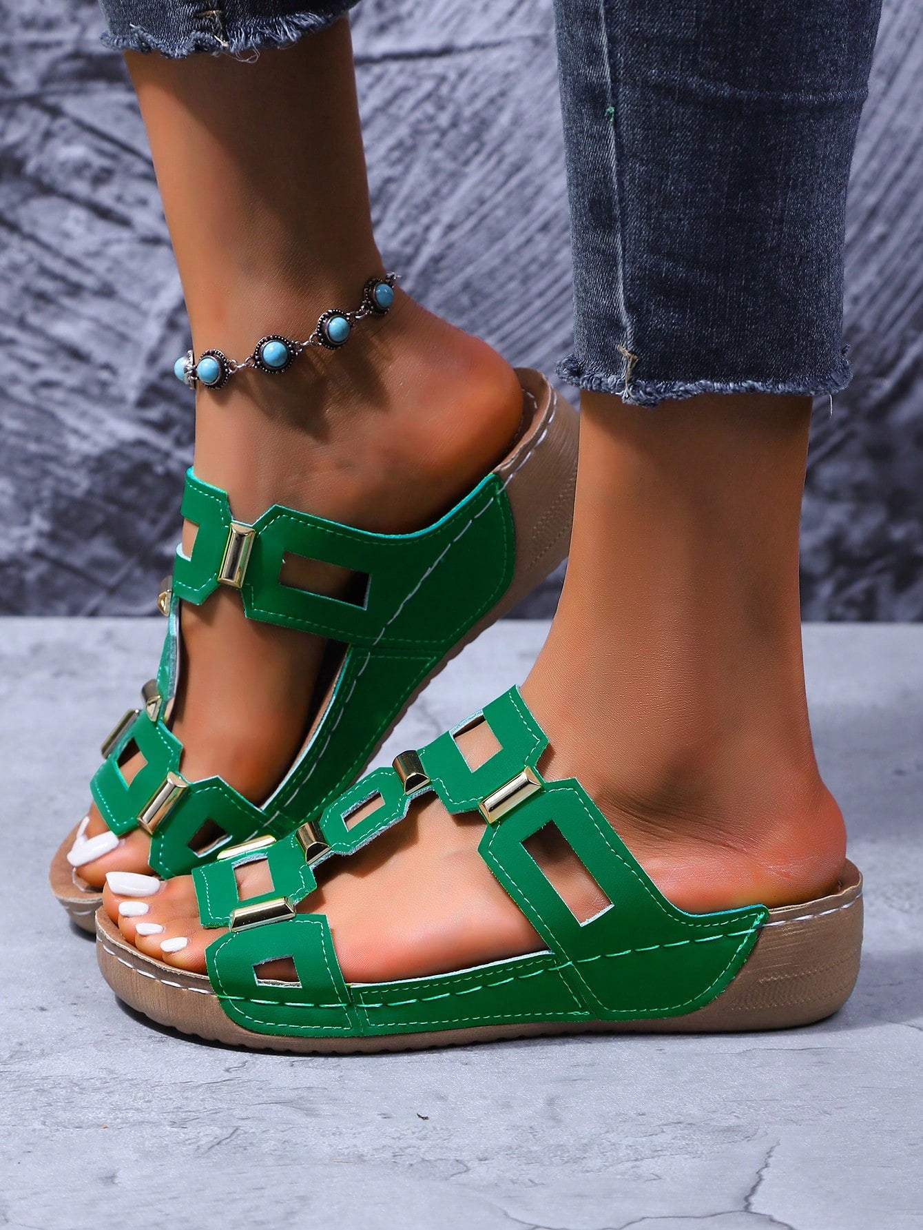 Women's open-toe wedge slide sandals with studded hollow-out upper, cross-over straps, buckle closure, and thick soft sole