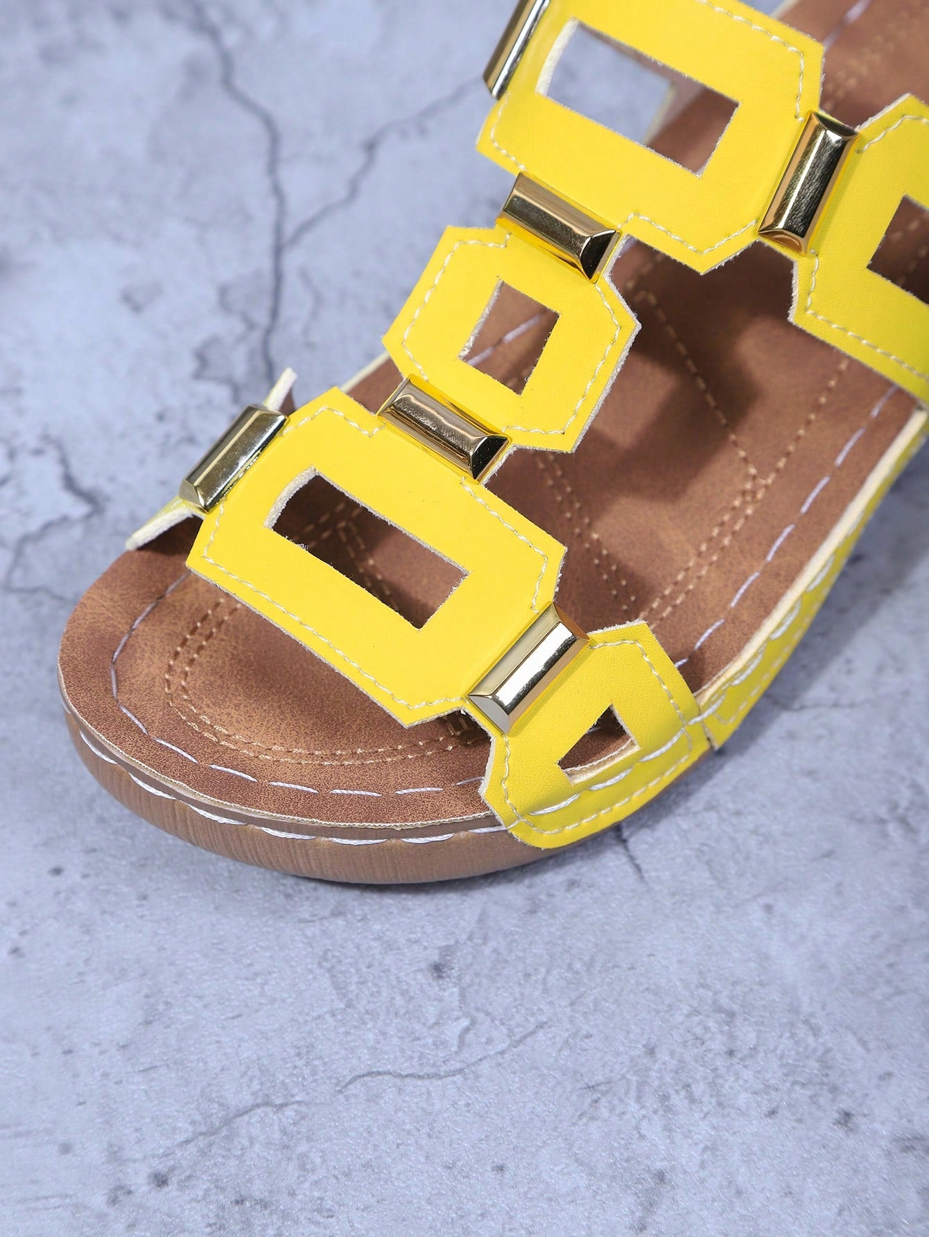 Women's open-toe wedge slide sandals with studded hollow-out upper, cross-over straps, buckle closure, and thick soft sole