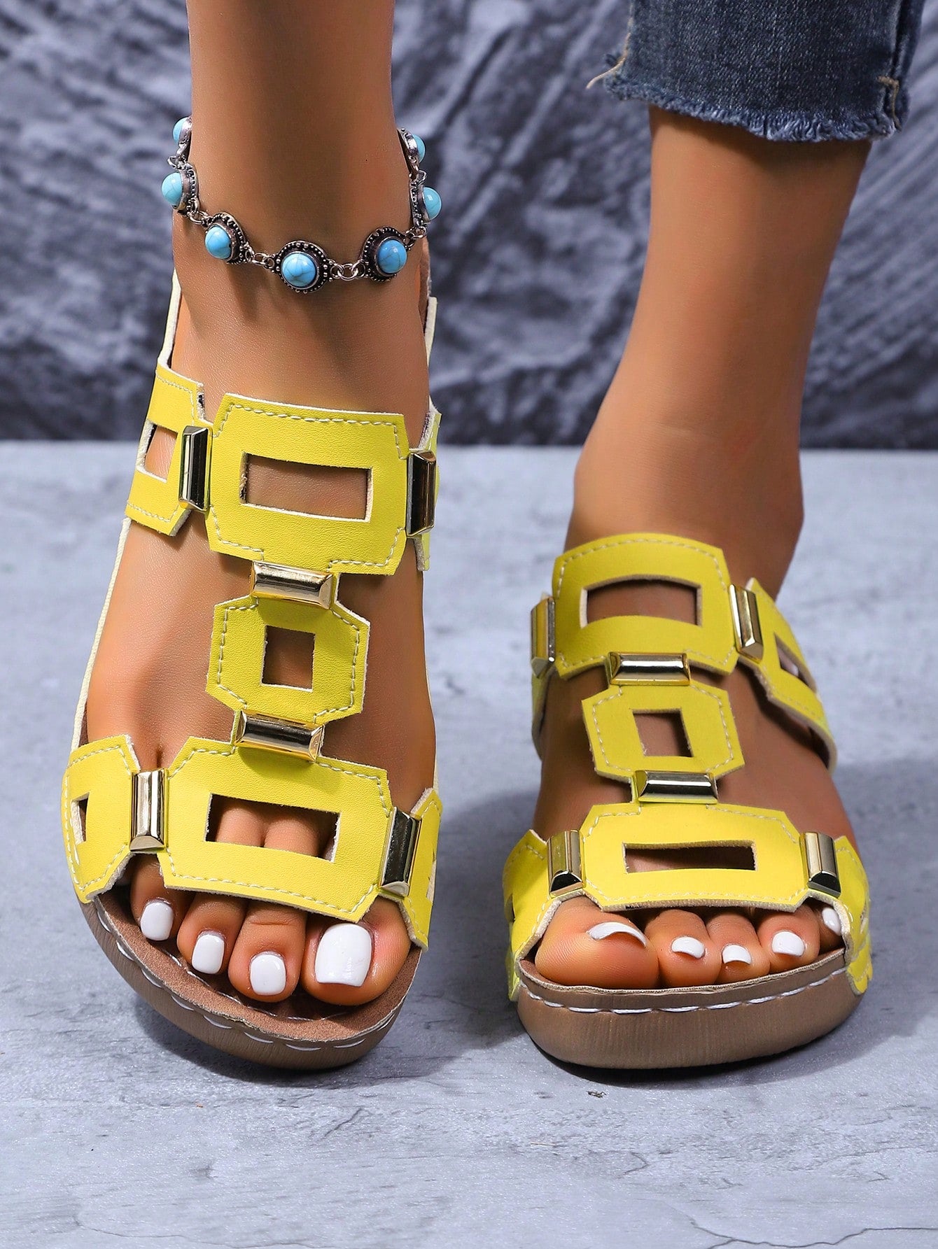 Women's open-toe wedge slide sandals with studded hollow-out upper, cross-over straps, buckle closure, and thick soft sole