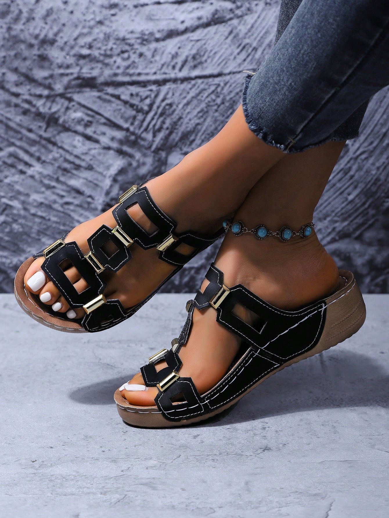 Women's open-toe wedge slide sandals with studded hollow-out upper, cross-over straps, buckle closure, and thick soft sole