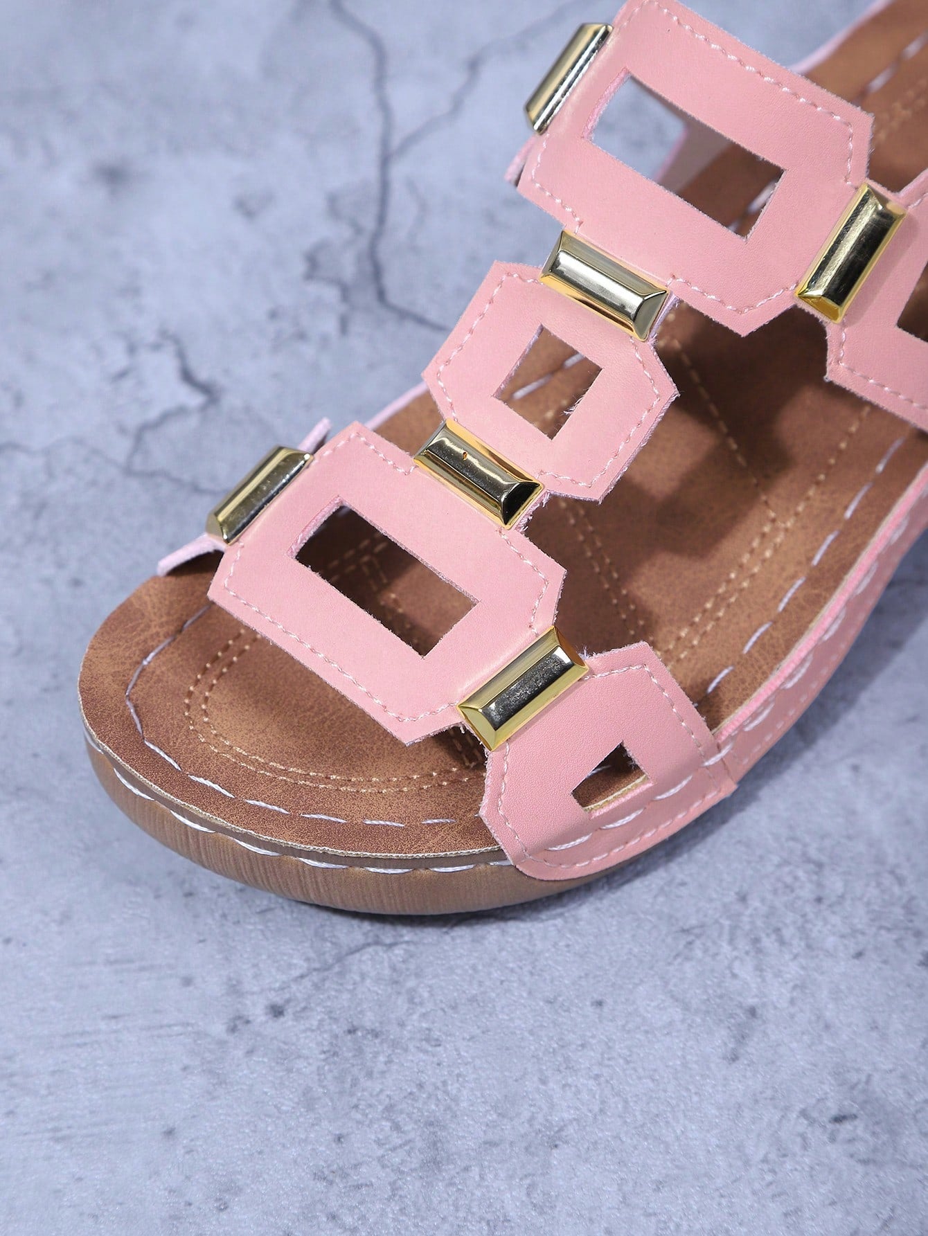 Women's open-toe wedge slide sandals with studded hollow-out upper, cross-over straps, buckle closure, and thick soft sole