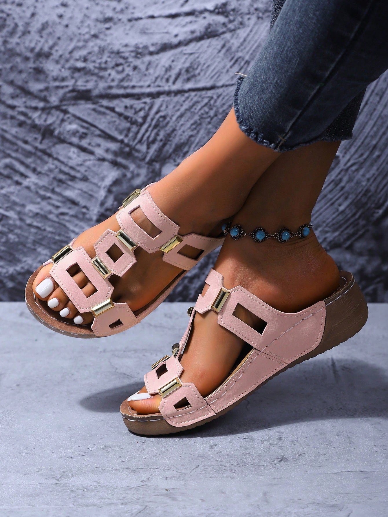 Women's open-toe wedge slide sandals with studded hollow-out upper, cross-over straps, buckle closure, and thick soft sole