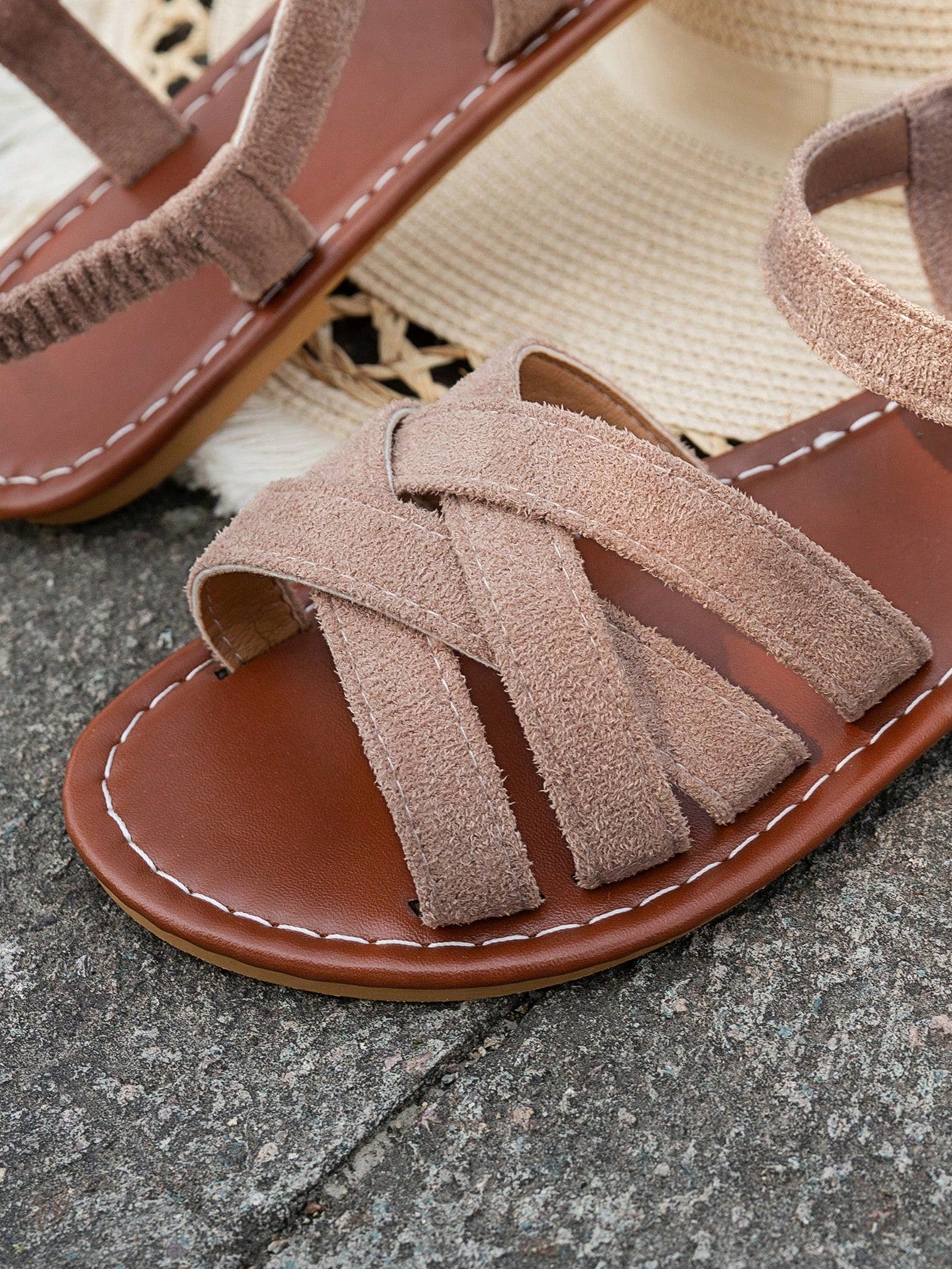 Women's flat thick sole gladiator sandals with cross adjustable straps and open toe, suitable for casual, vacation, and beach wear.