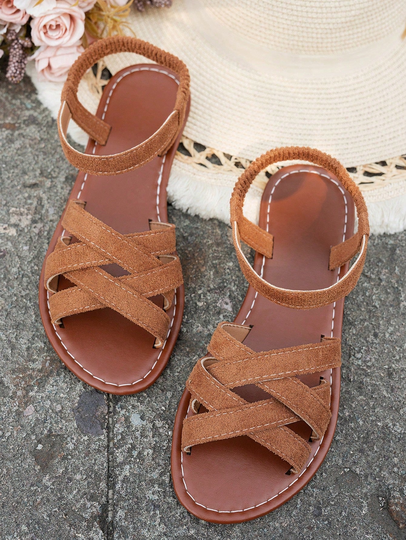 Women's flat thick sole gladiator sandals with cross adjustable straps and open toe, suitable for casual, vacation, and beach wear.