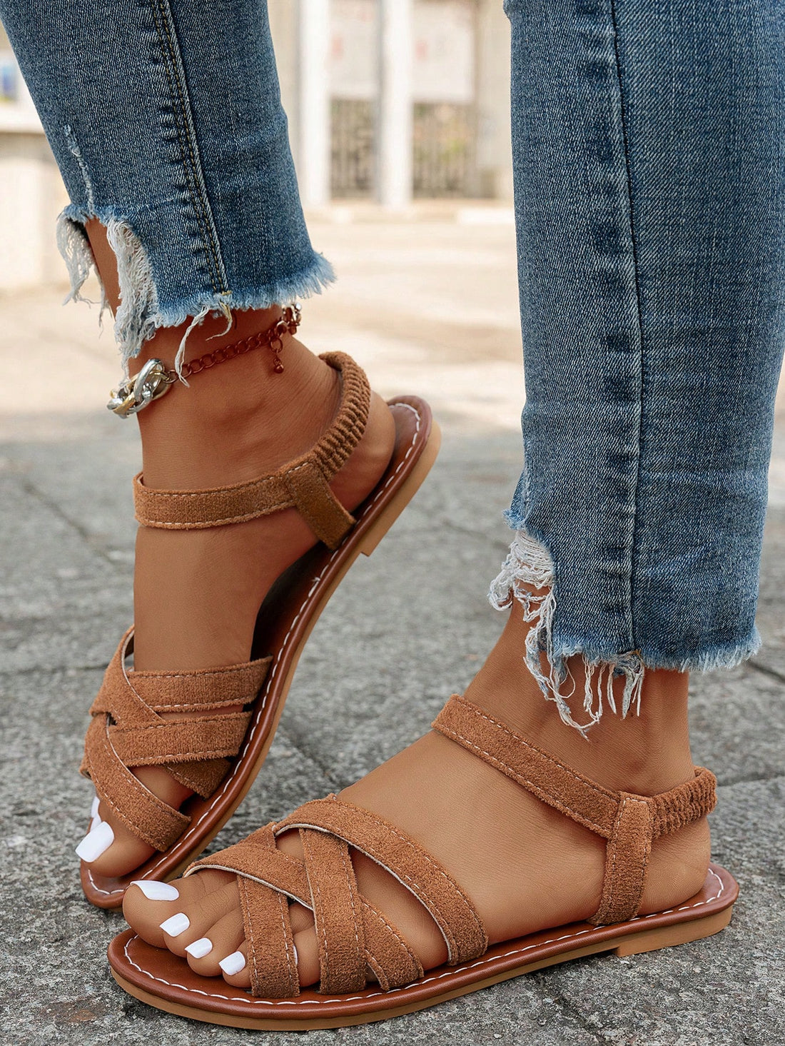 Women's flat thick sole gladiator sandals with cross adjustable straps and open toe, suitable for casual, vacation, and beach wear.