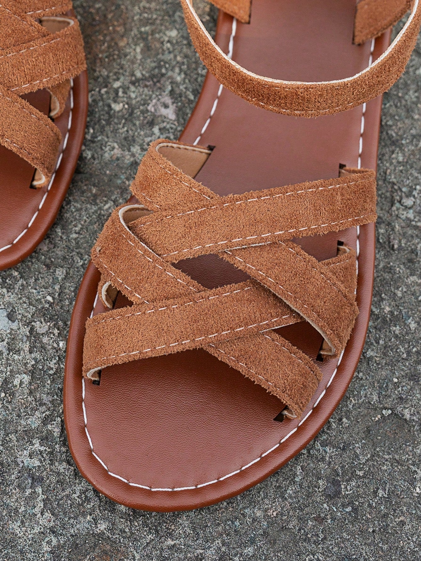 Women's flat thick sole gladiator sandals with cross adjustable straps and open toe, suitable for casual, vacation, and beach wear.