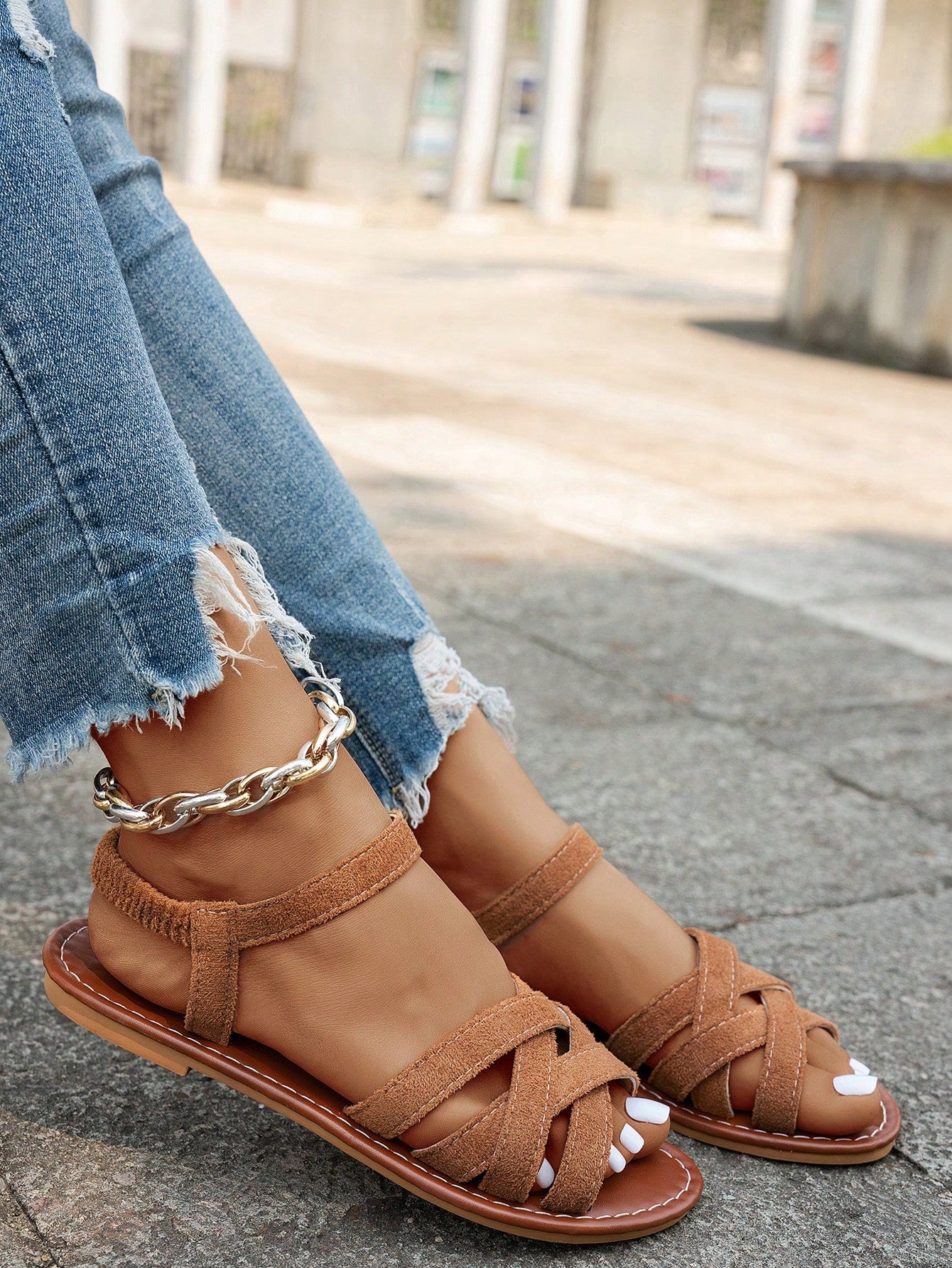 Women's flat thick sole gladiator sandals with cross adjustable straps and open toe, suitable for casual, vacation, and beach wear.